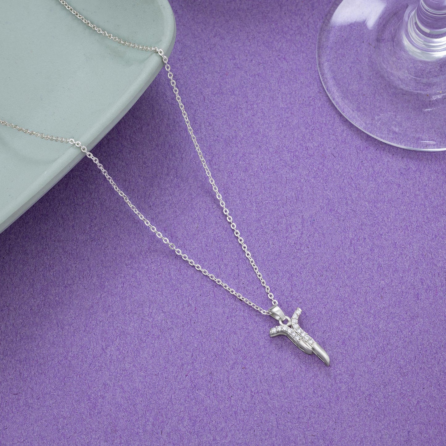 silver necklace with a diamond pendant