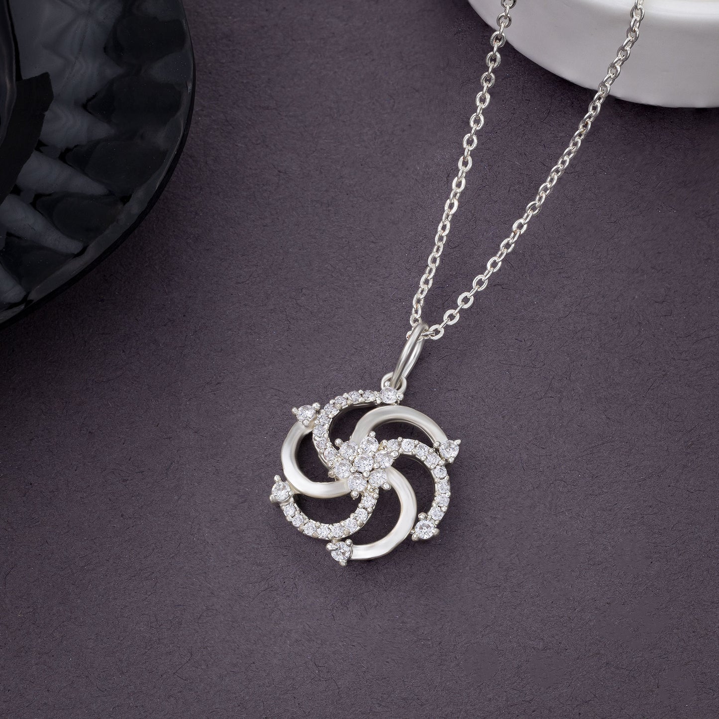 silver necklace with a diamond pendant