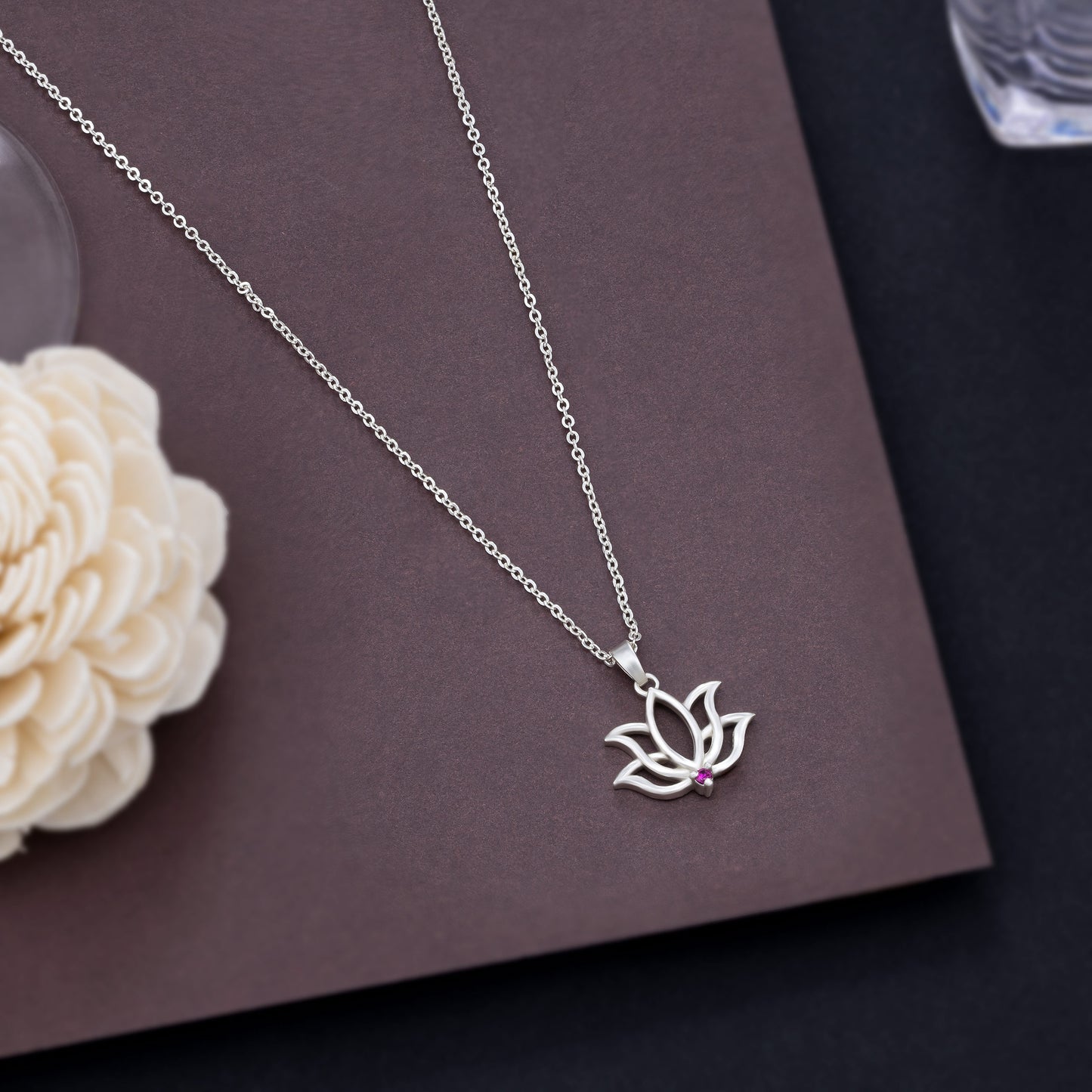 silver necklace with a lotus flower