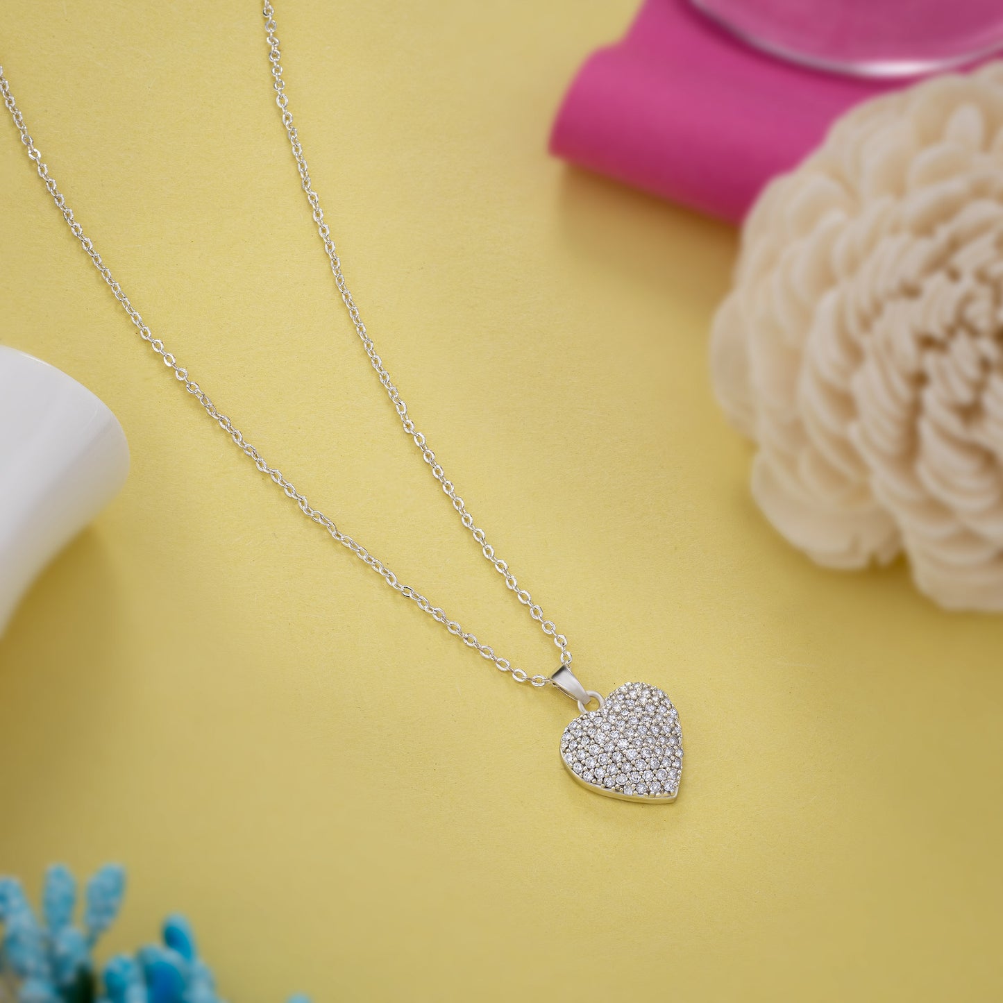 silver necklace with a heart pendant