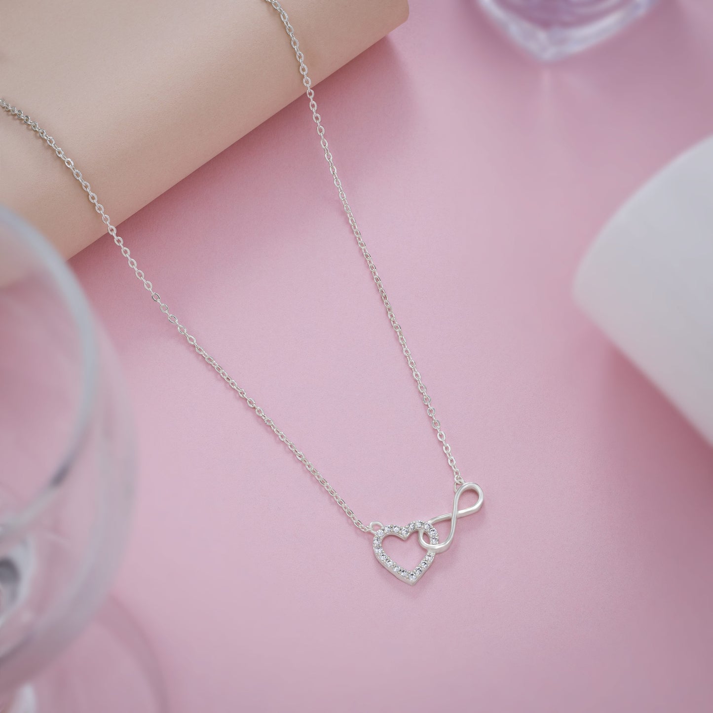 silver necklace with heart and infinity