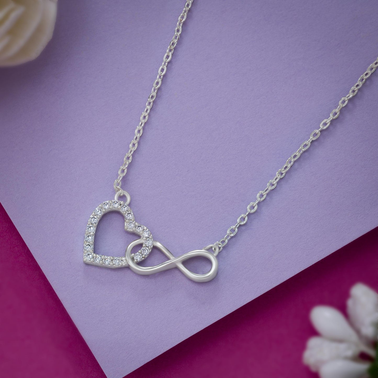 silver necklace with heart and infinity