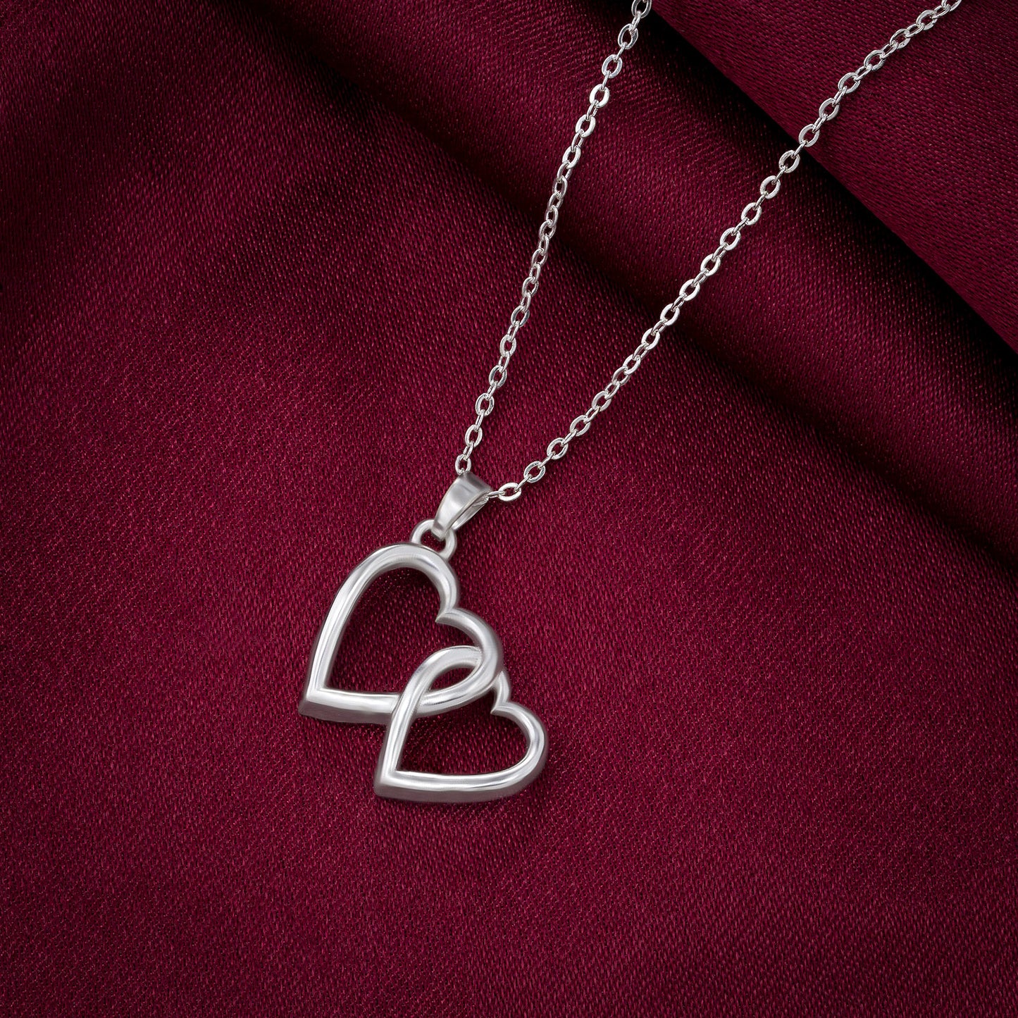 silver heart pendant with a chain