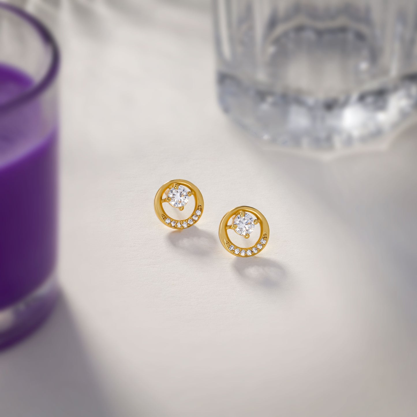 pair of golden plated earrings with sparkling stones