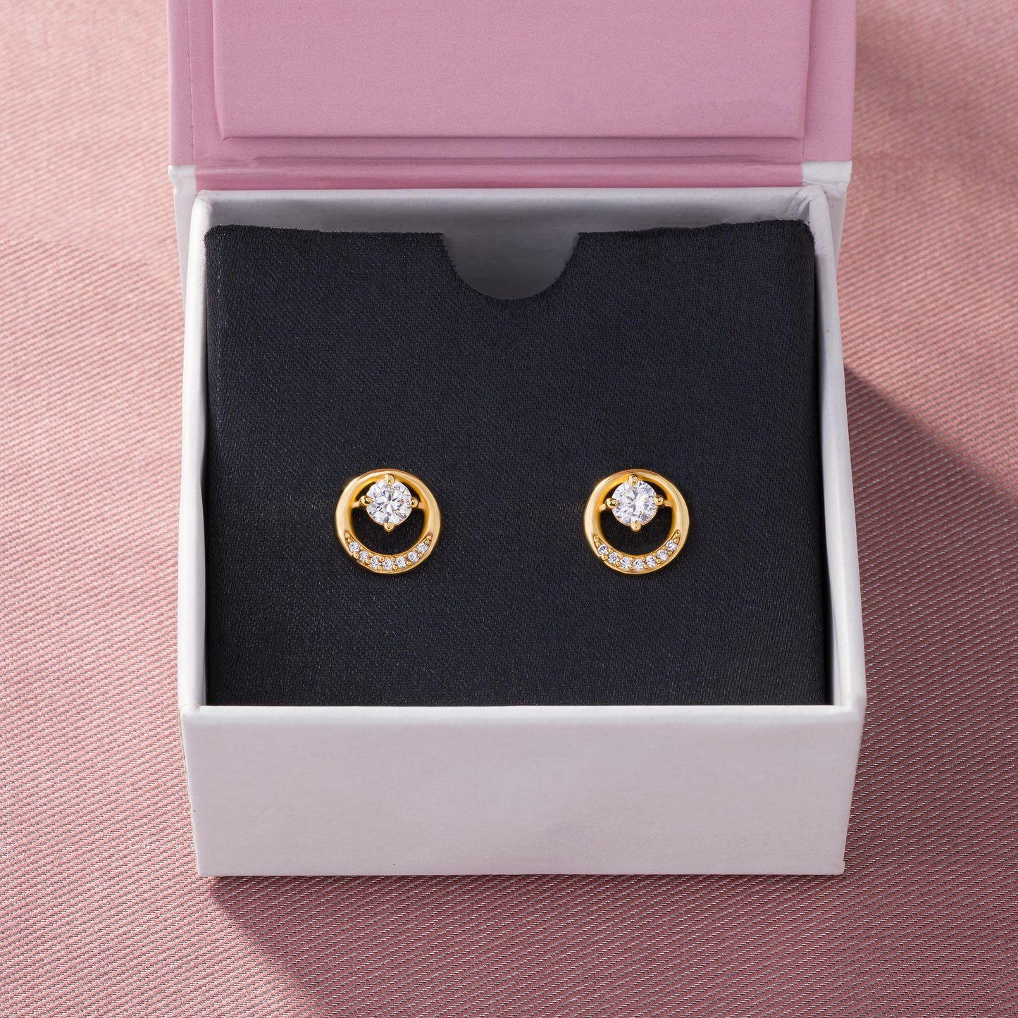 pair of golden plated earrings with sparkling stones