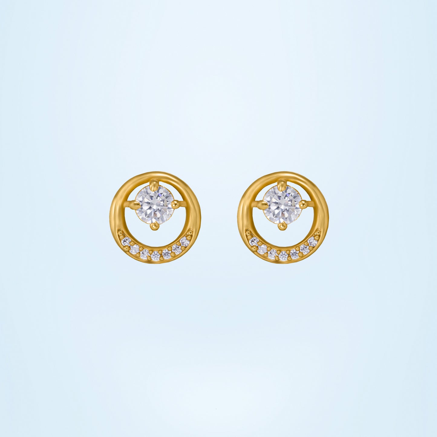 pair of golden plated earrings with sparkling stones