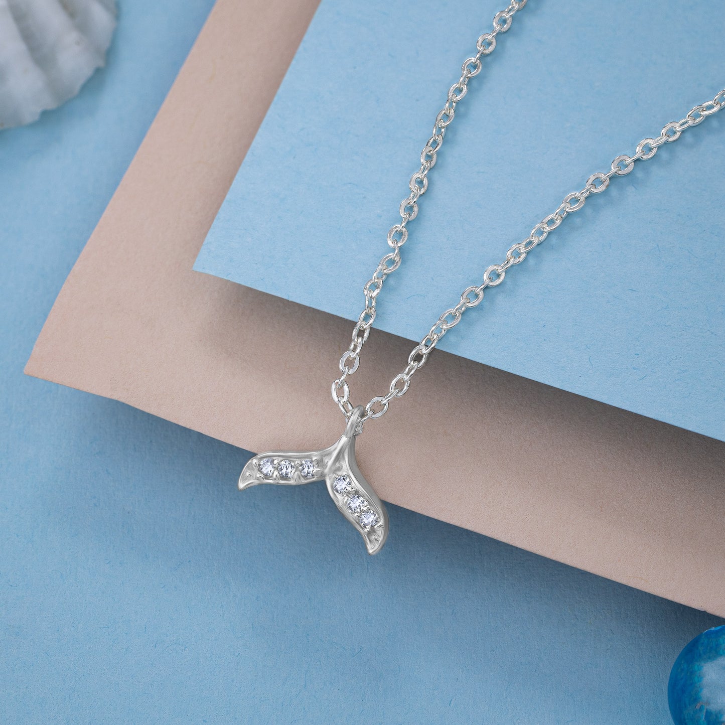 silver necklace with a diamond