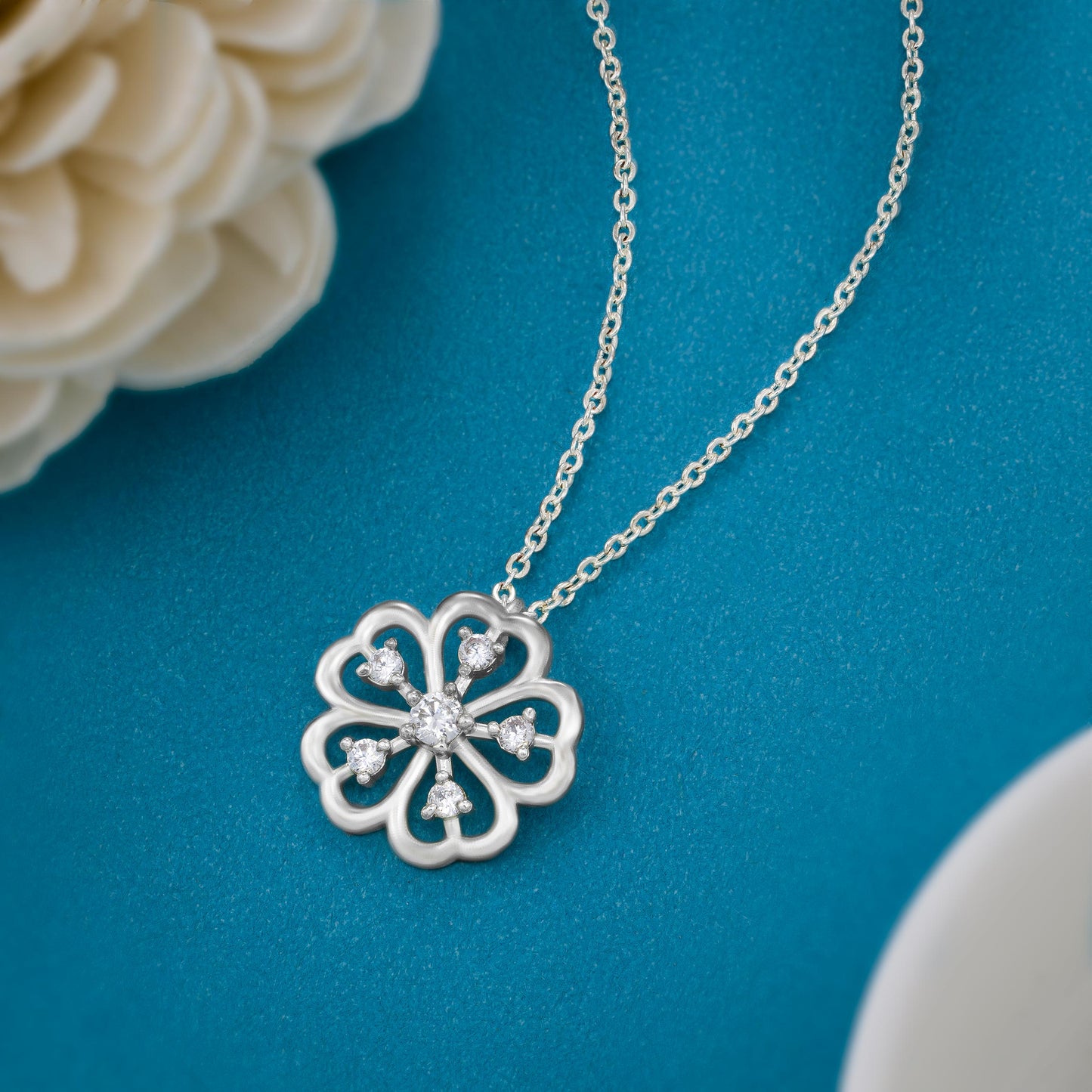 silver necklace with a clover design