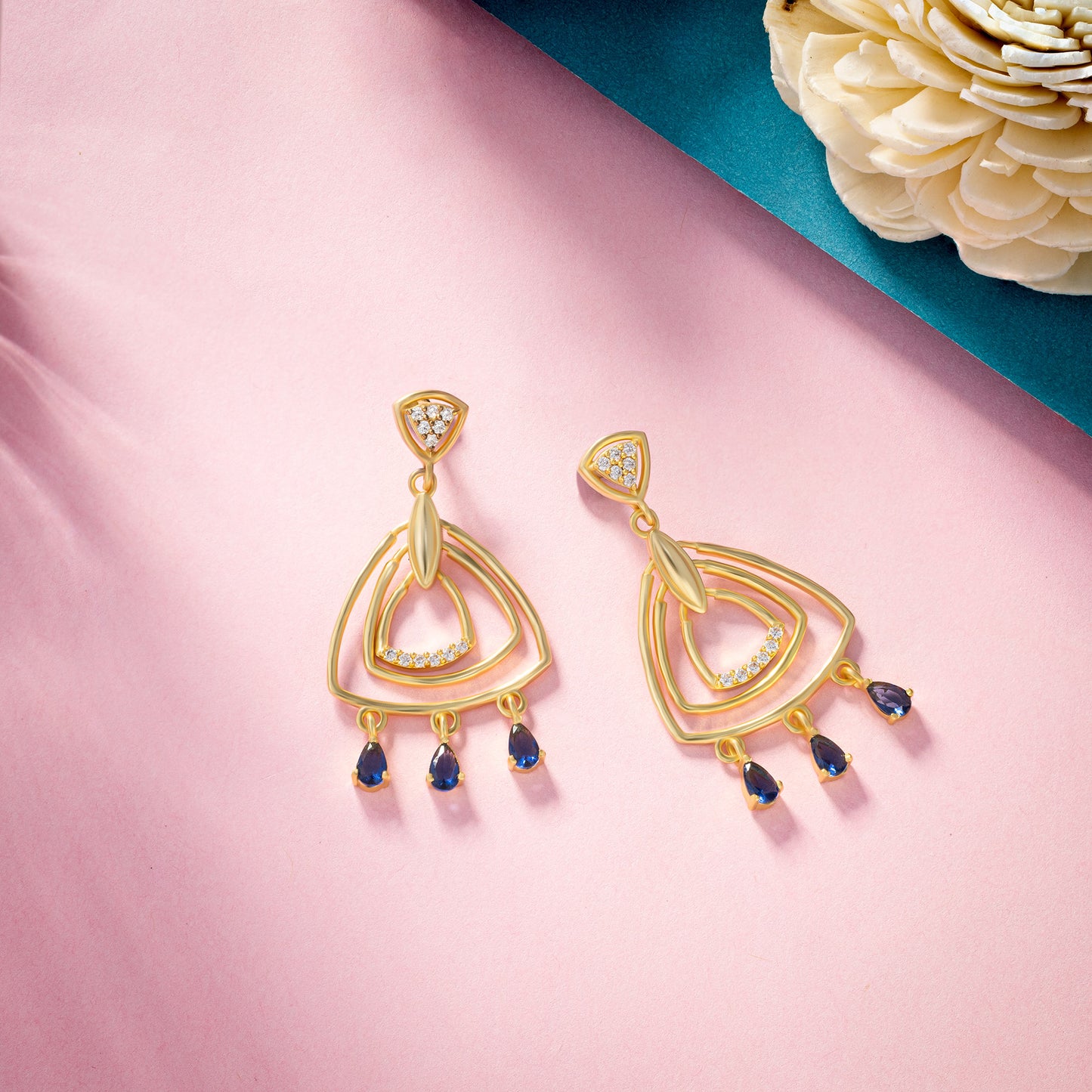 pair of golden earrings with diamonds