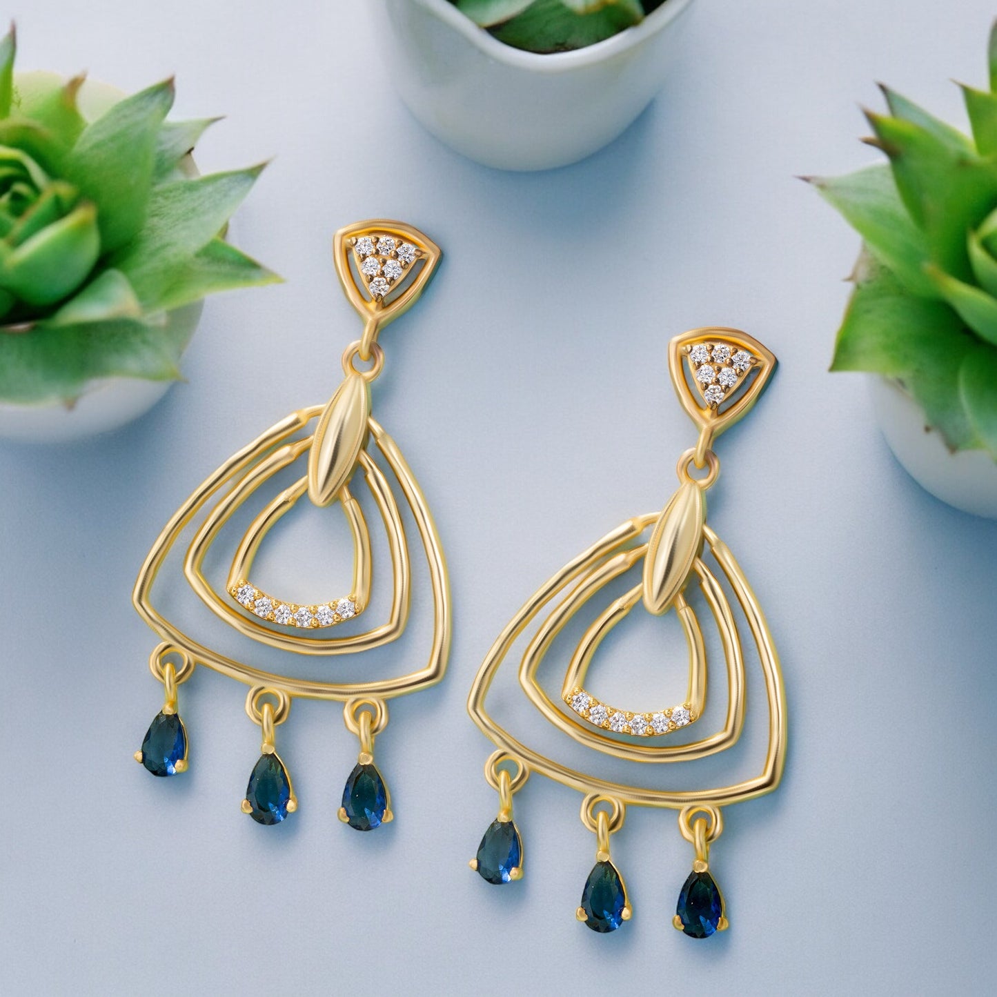 pair of golden earrings with diamonds