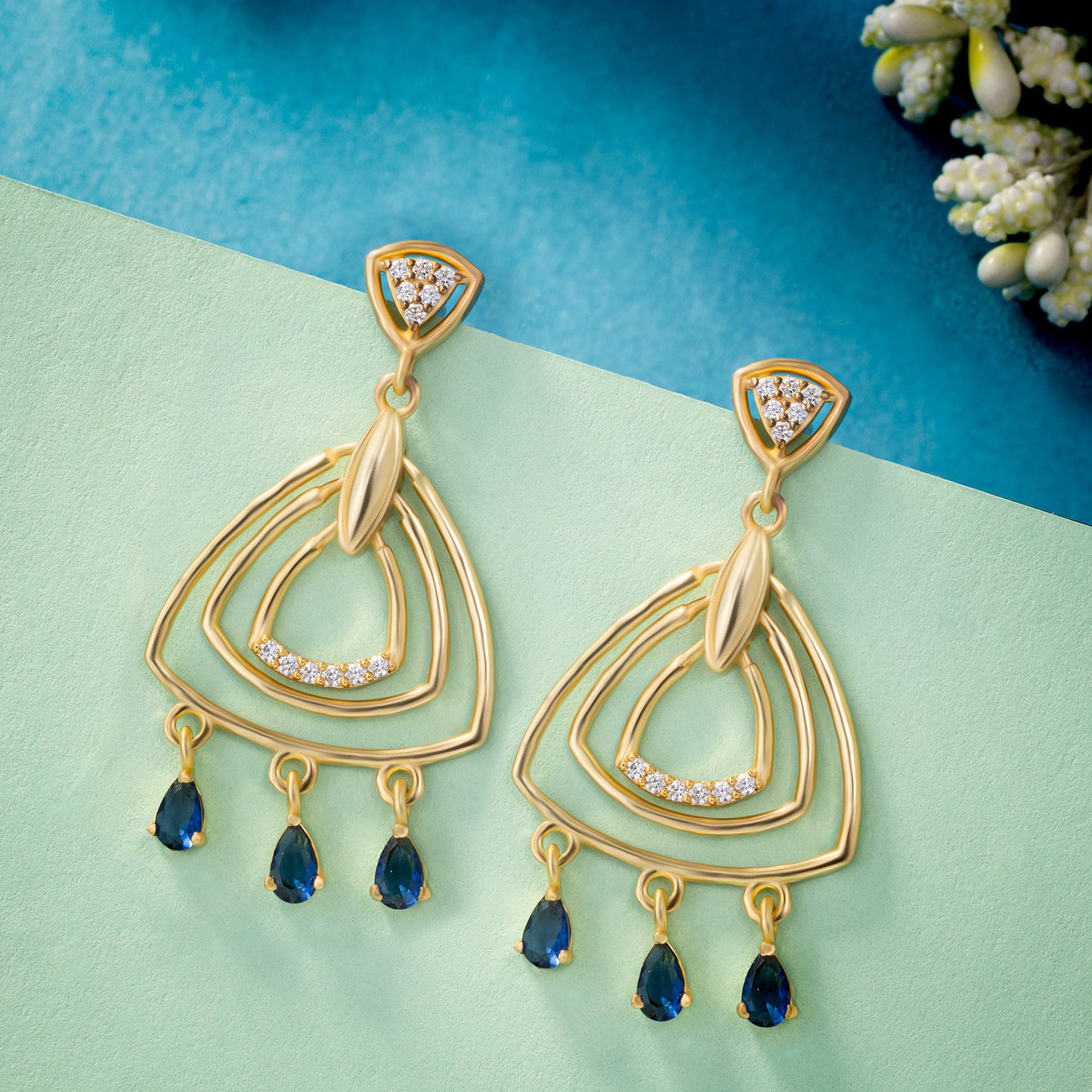 pair of golden earrings with diamonds