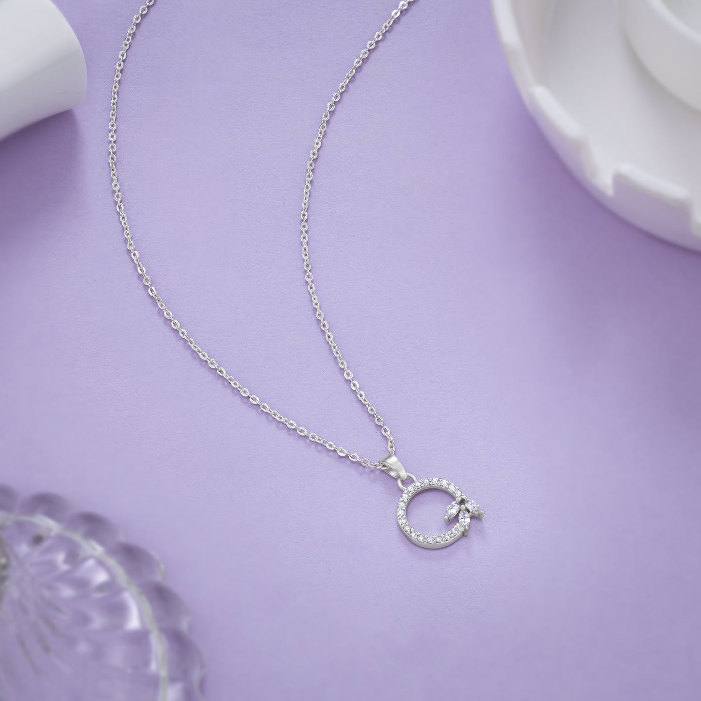 silver necklace with a diamond letter on it