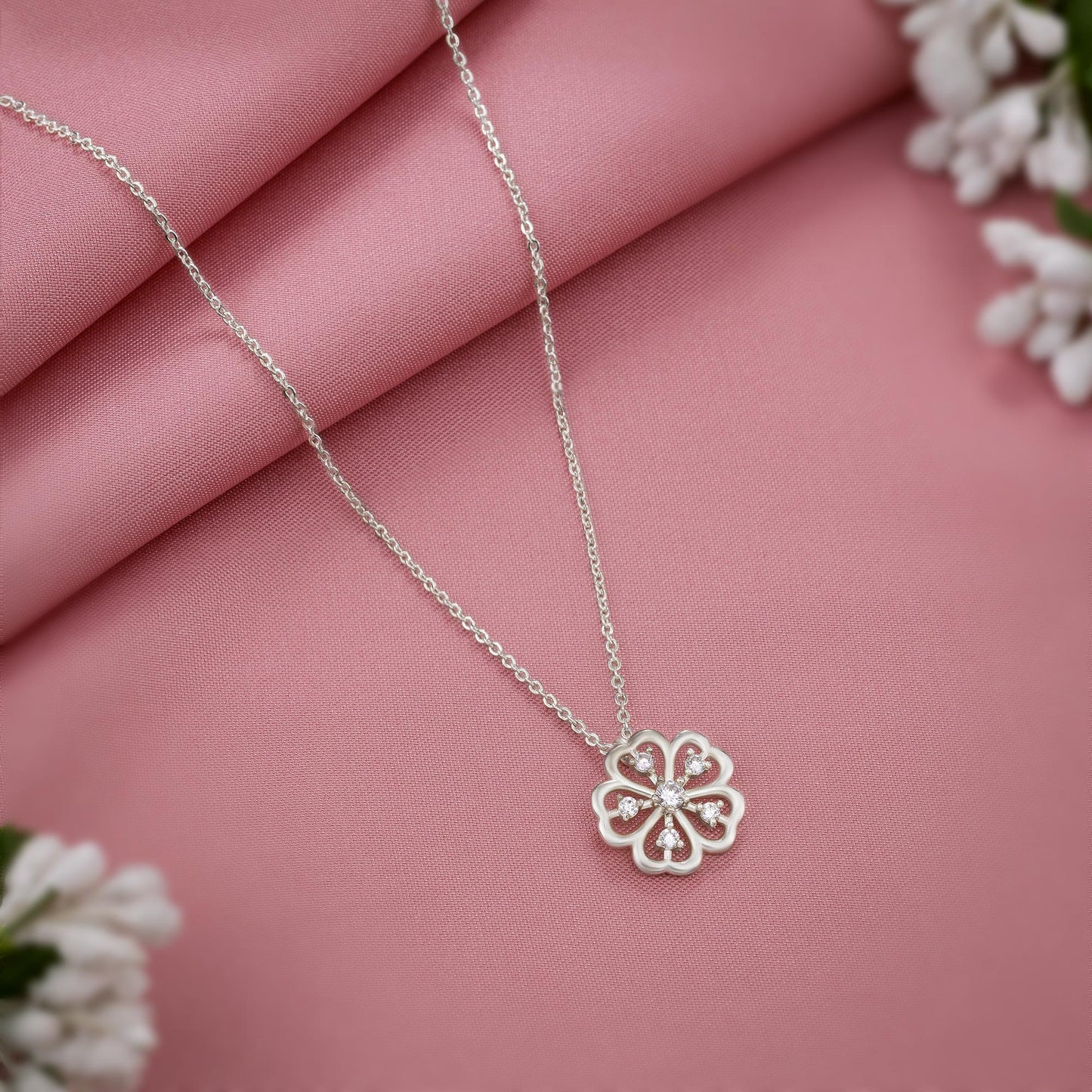 silver necklace with a clover design