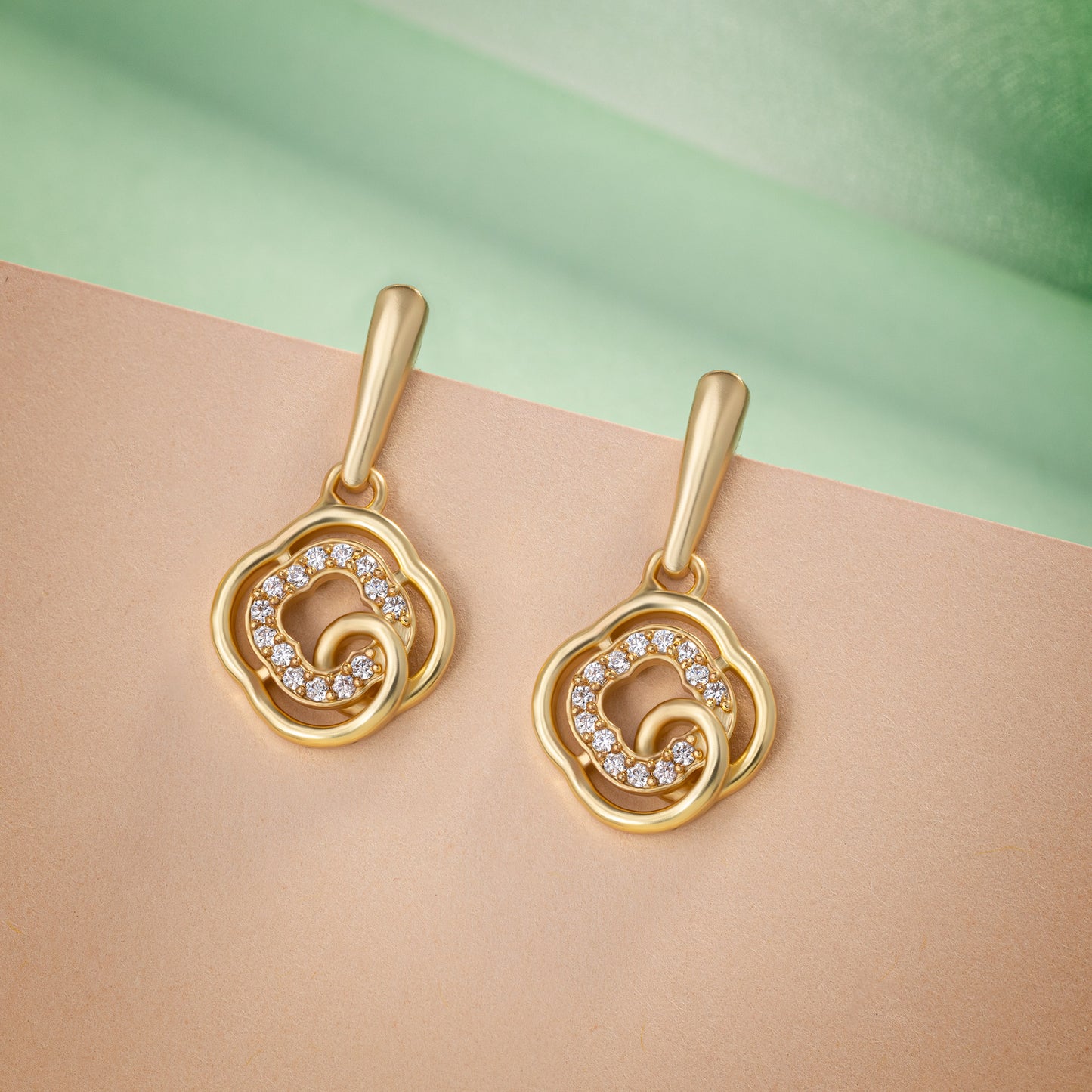 golden earrings with white diamonds