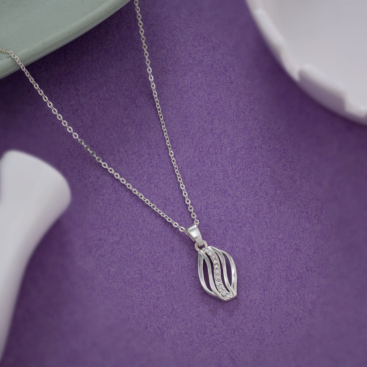 silver necklace with a diamond pendant