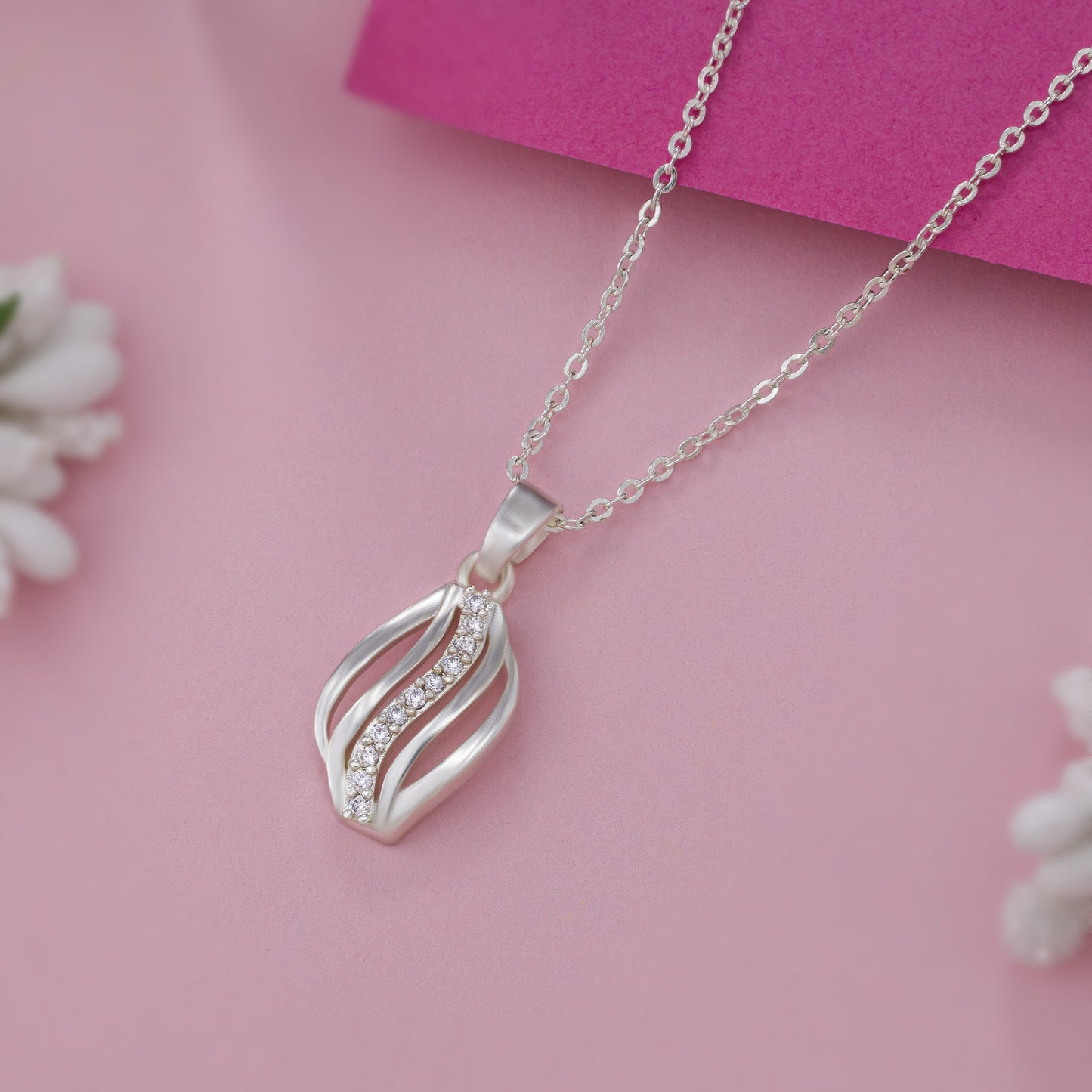 silver necklace with a diamond pendant