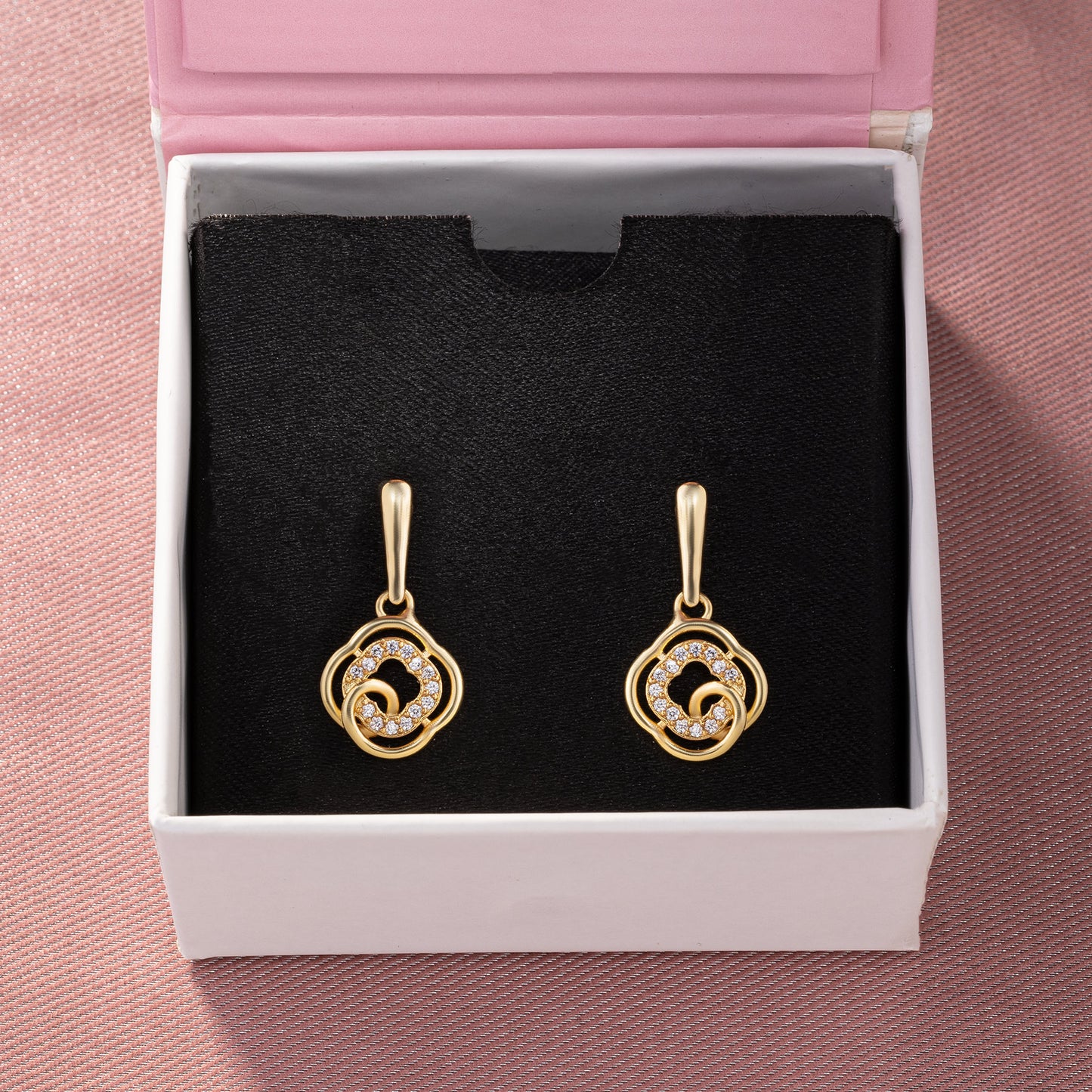 golden earrings with white diamonds