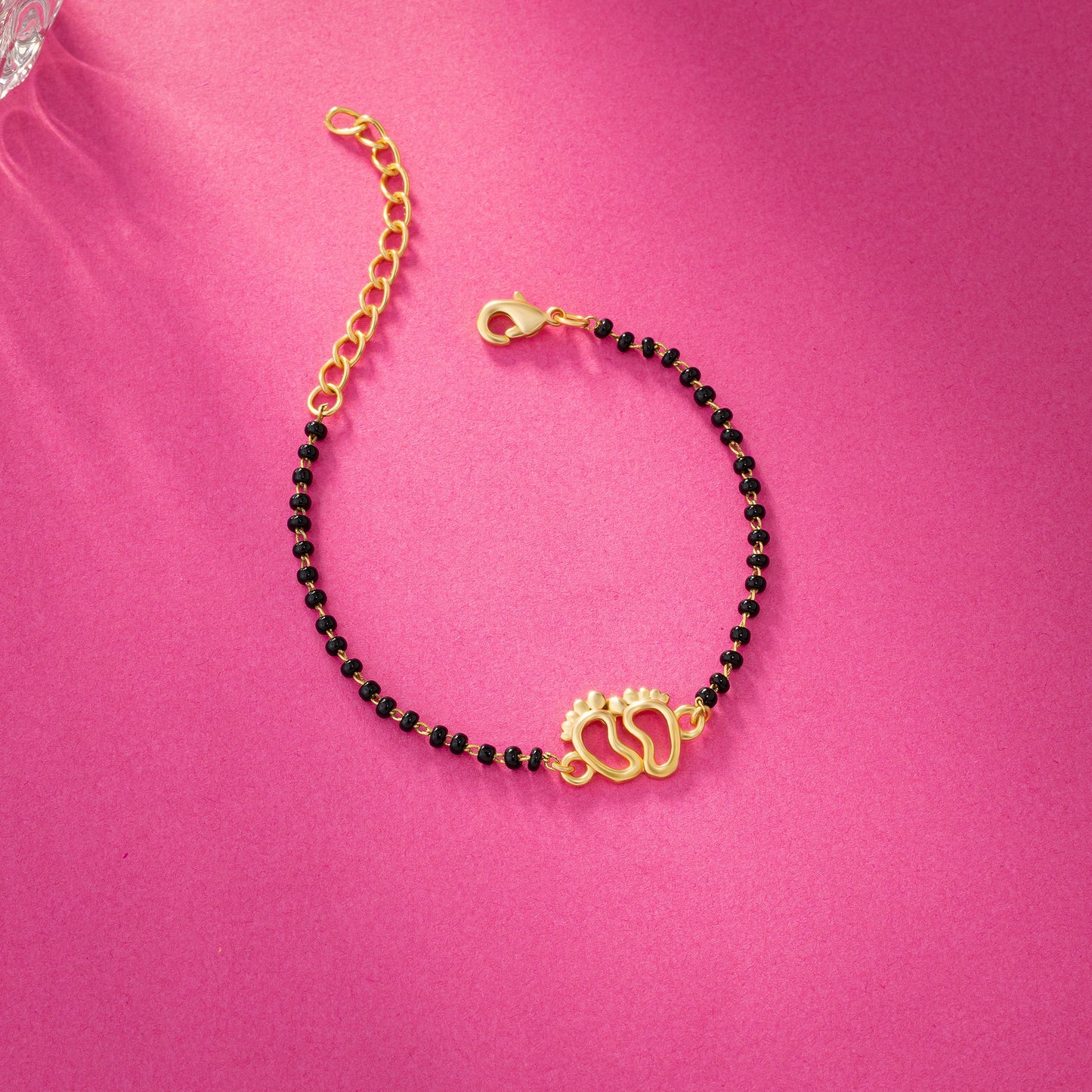 bracelet with a golden and black bea