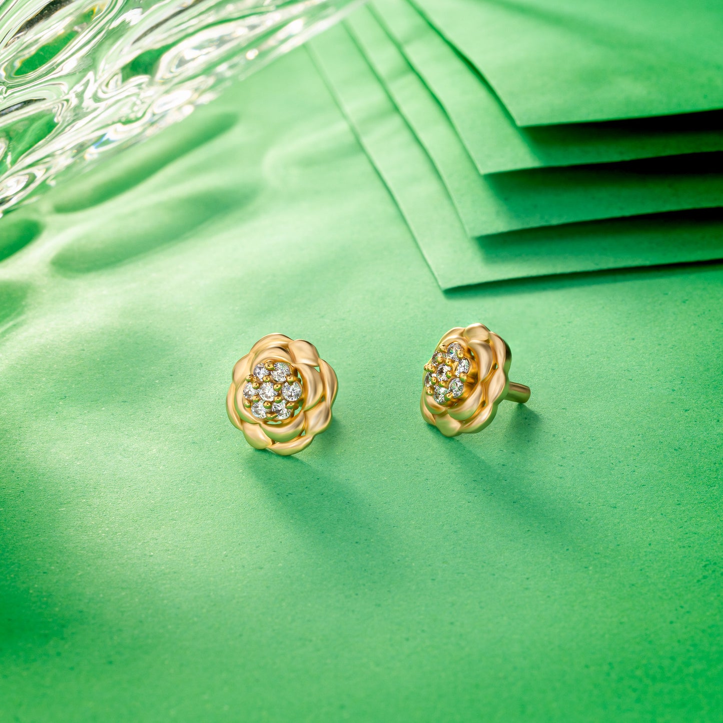 golden flower stud earrings with white diamonds