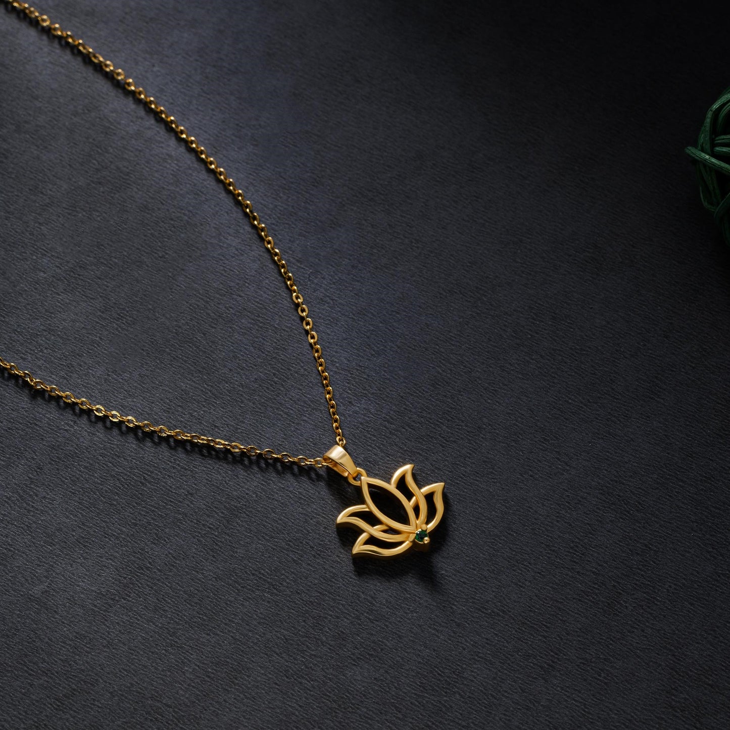 golden necklace with a lotus flower