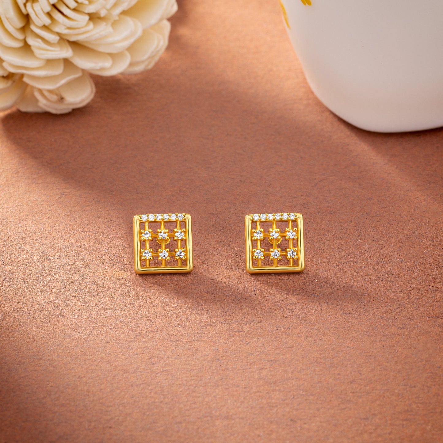 pair of golden earrings with diamonds