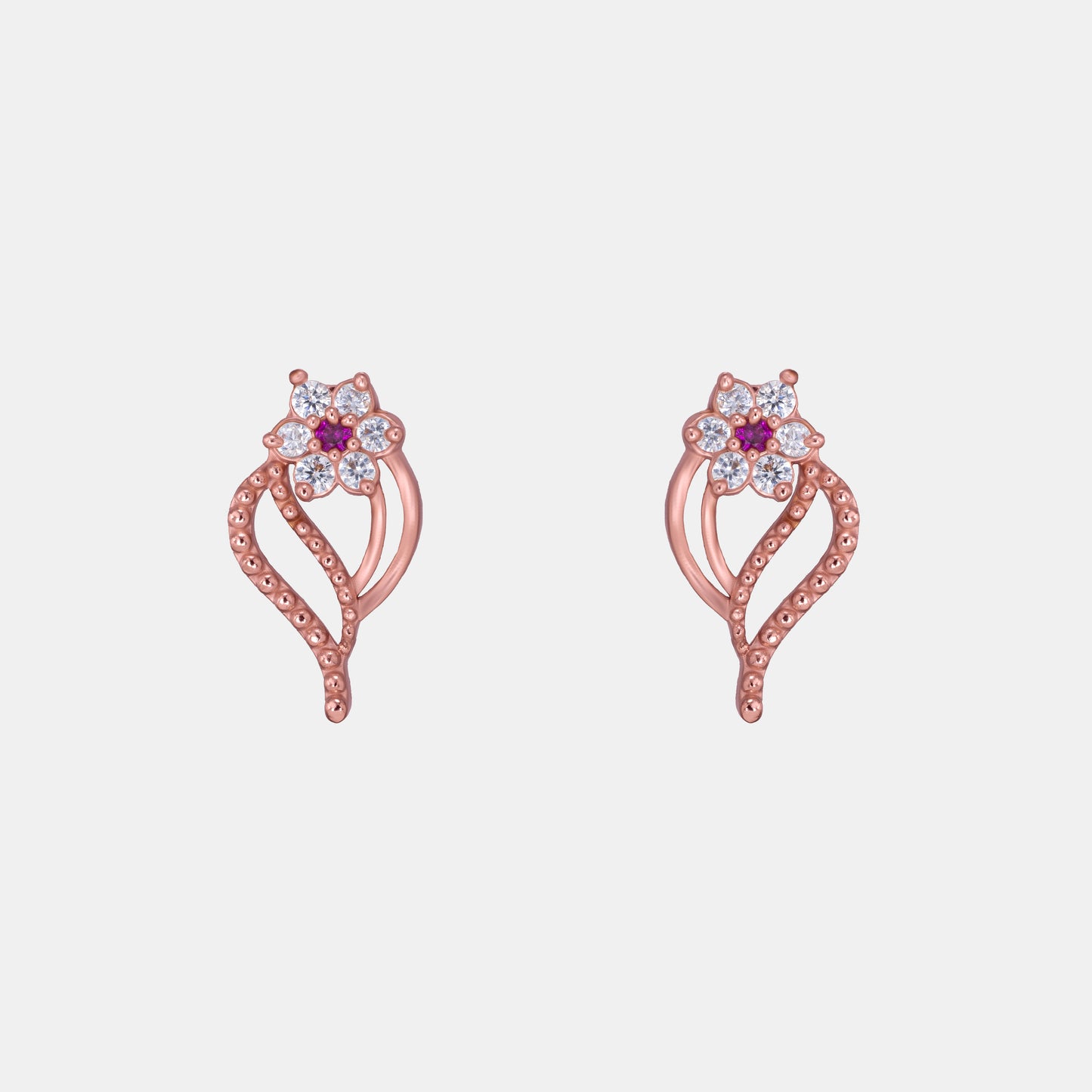 pair of rose gold earrings with diamonds and stones