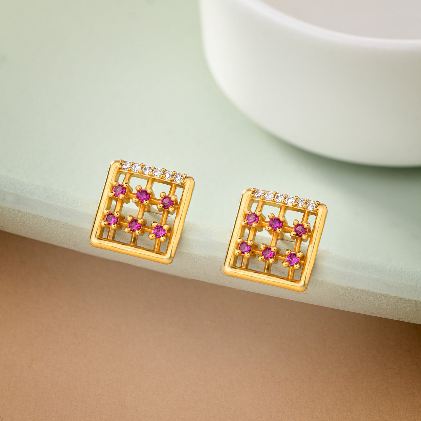 pair of golden earrings with diamonds