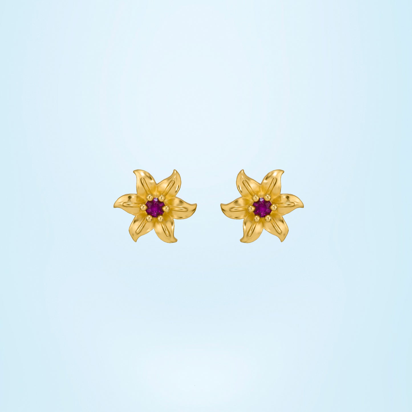 pair of golden earrings with white stones