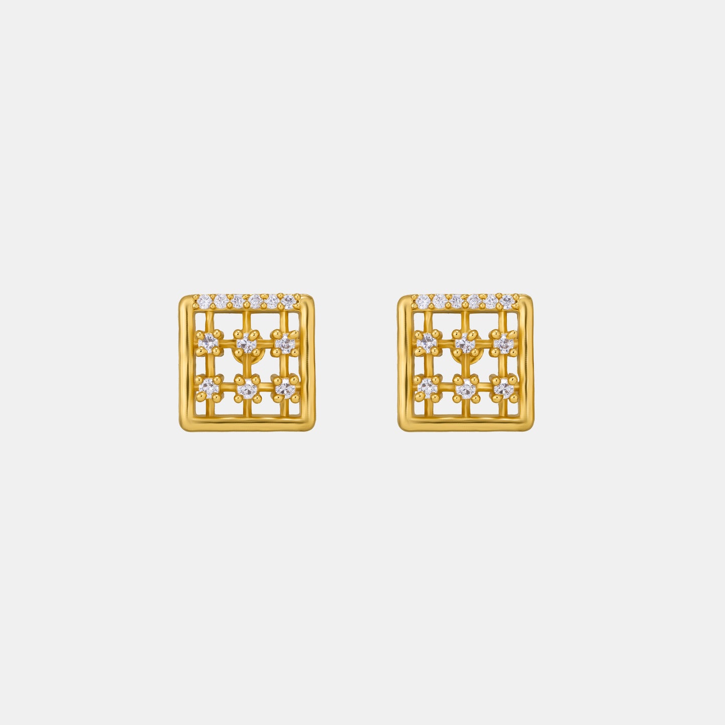 pair of golden earrings with white diamonds