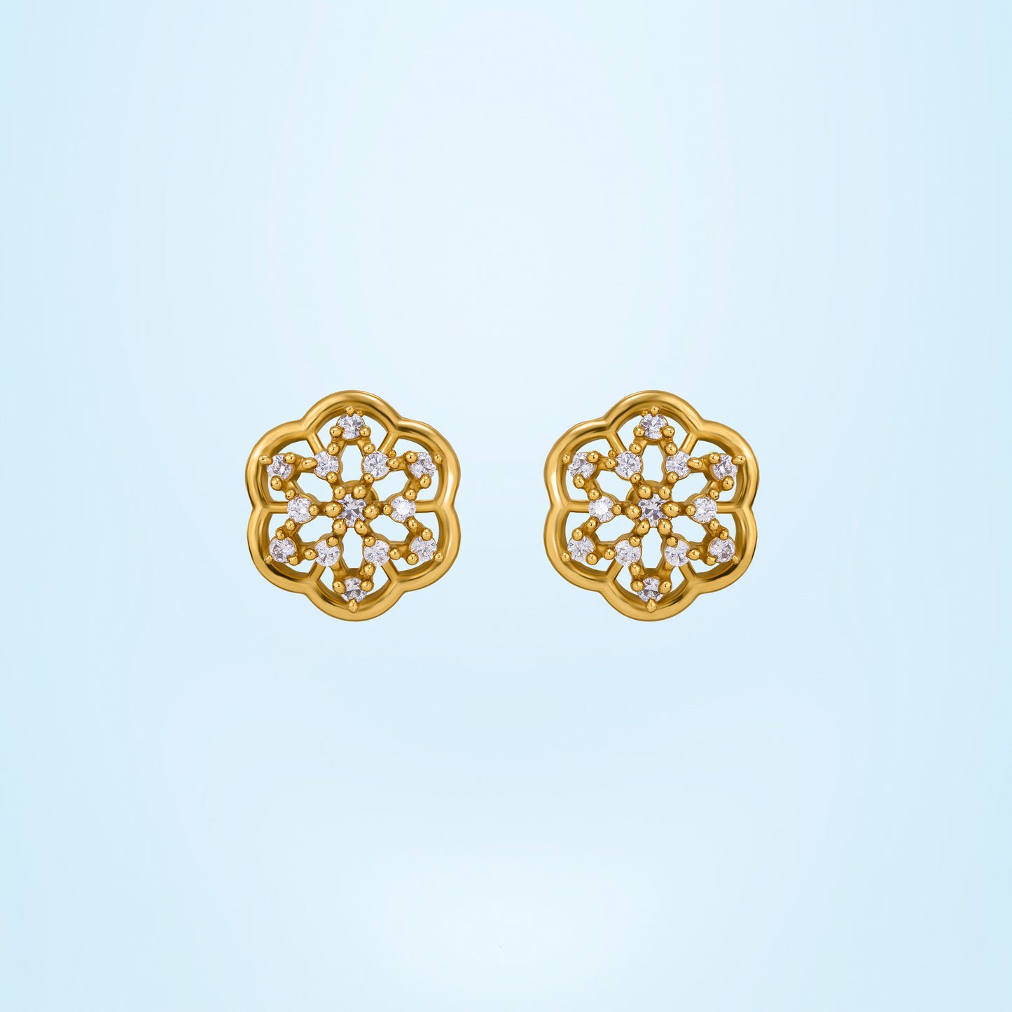 pair of golden earrings with white diamonds