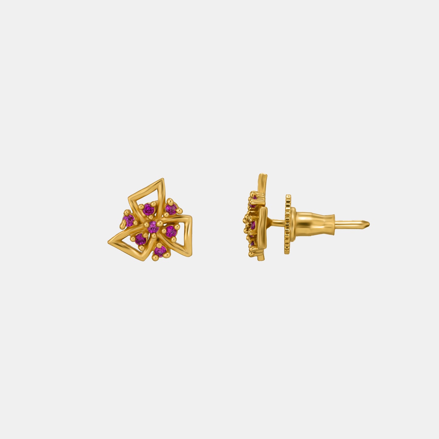 pair of golden earrings with stones