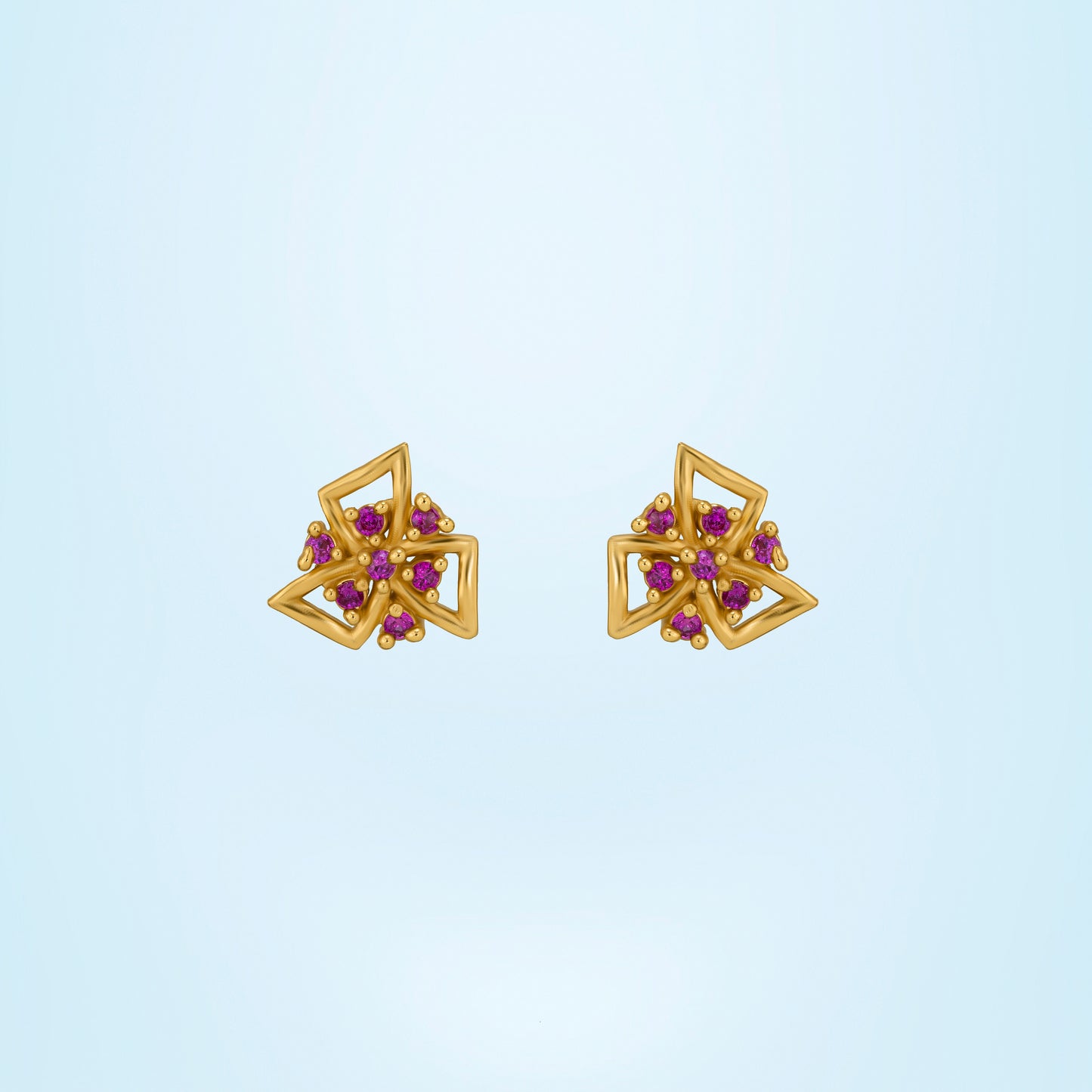 pair of golden earrings with stones