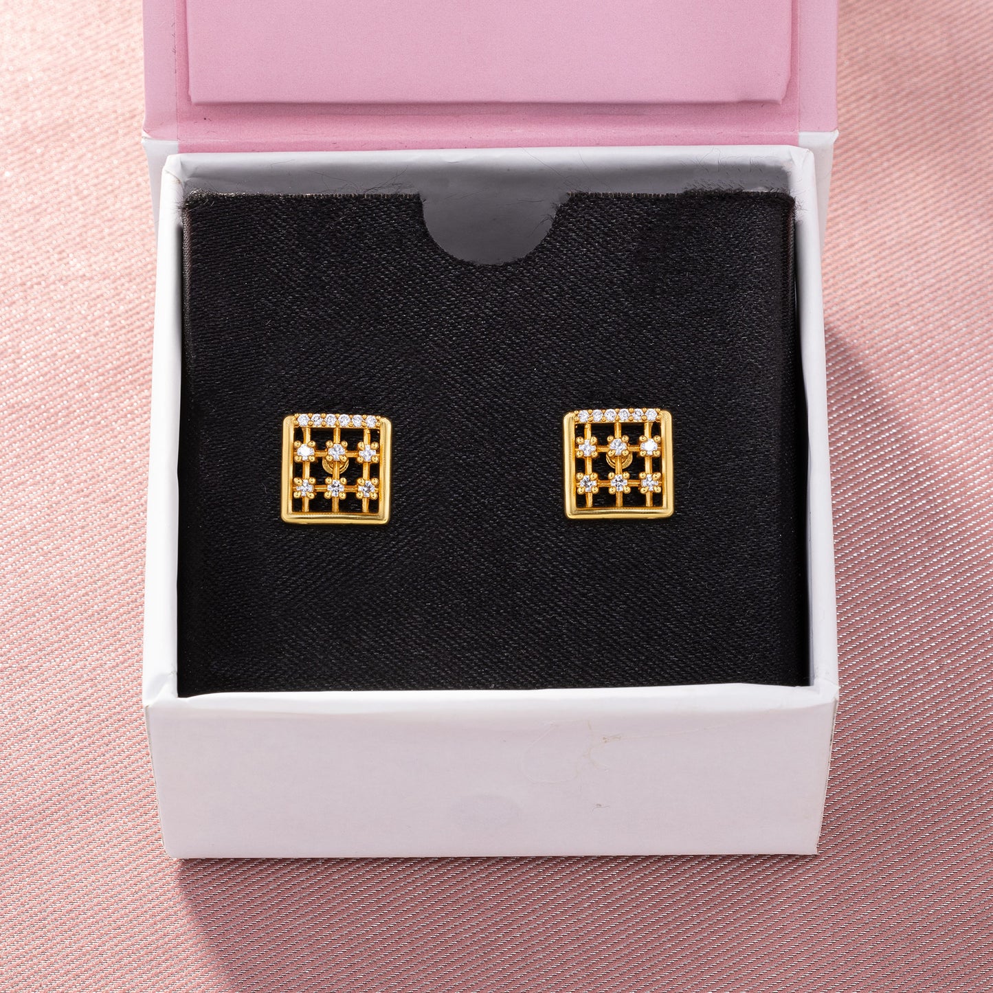 pair of golden earrings with diamonds