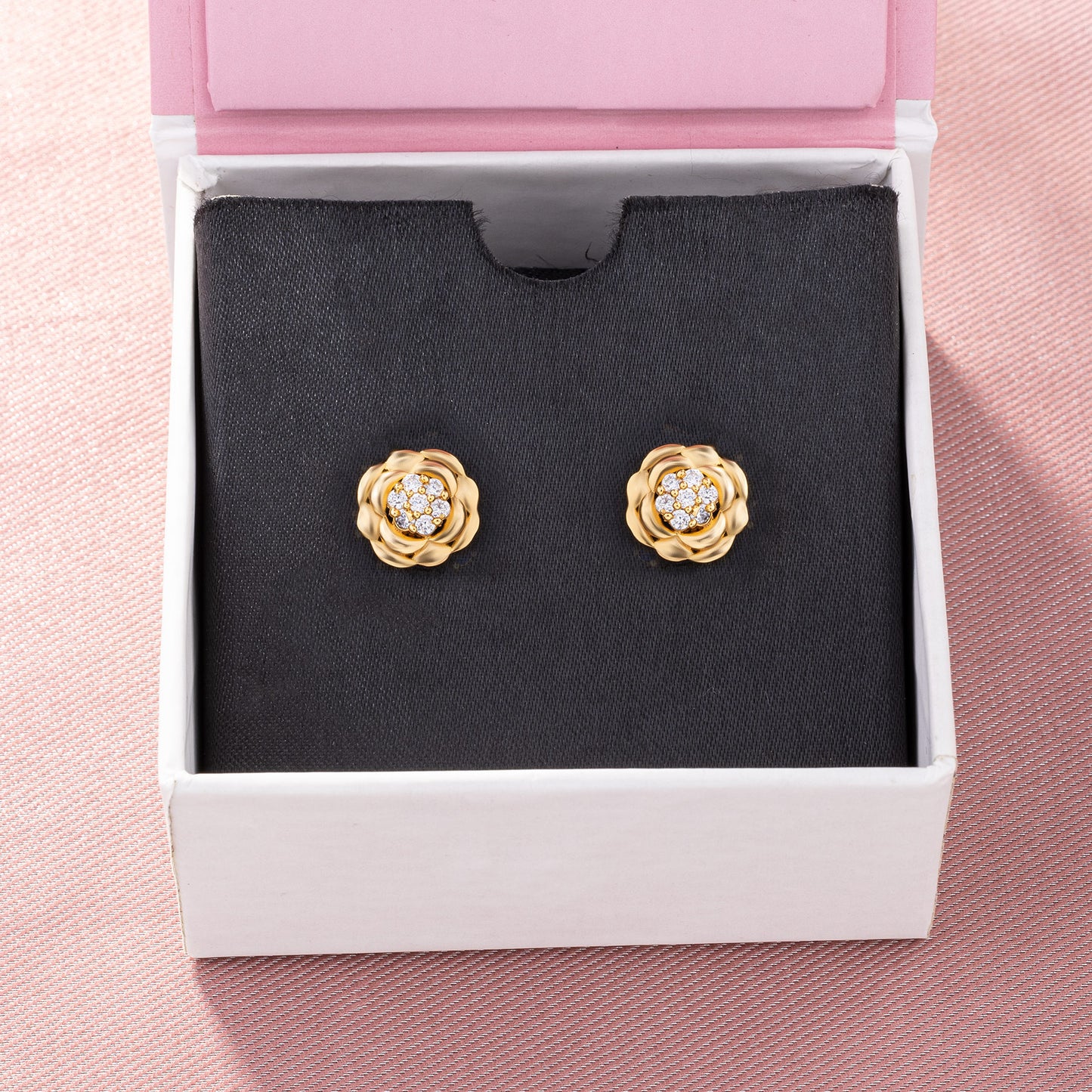 golden flower stud earrings with white diamonds