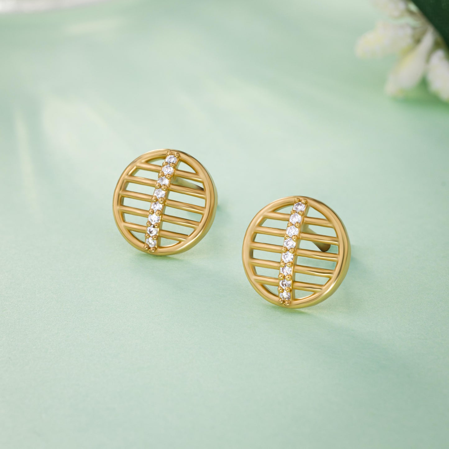 pair of golden earrings with diamonds