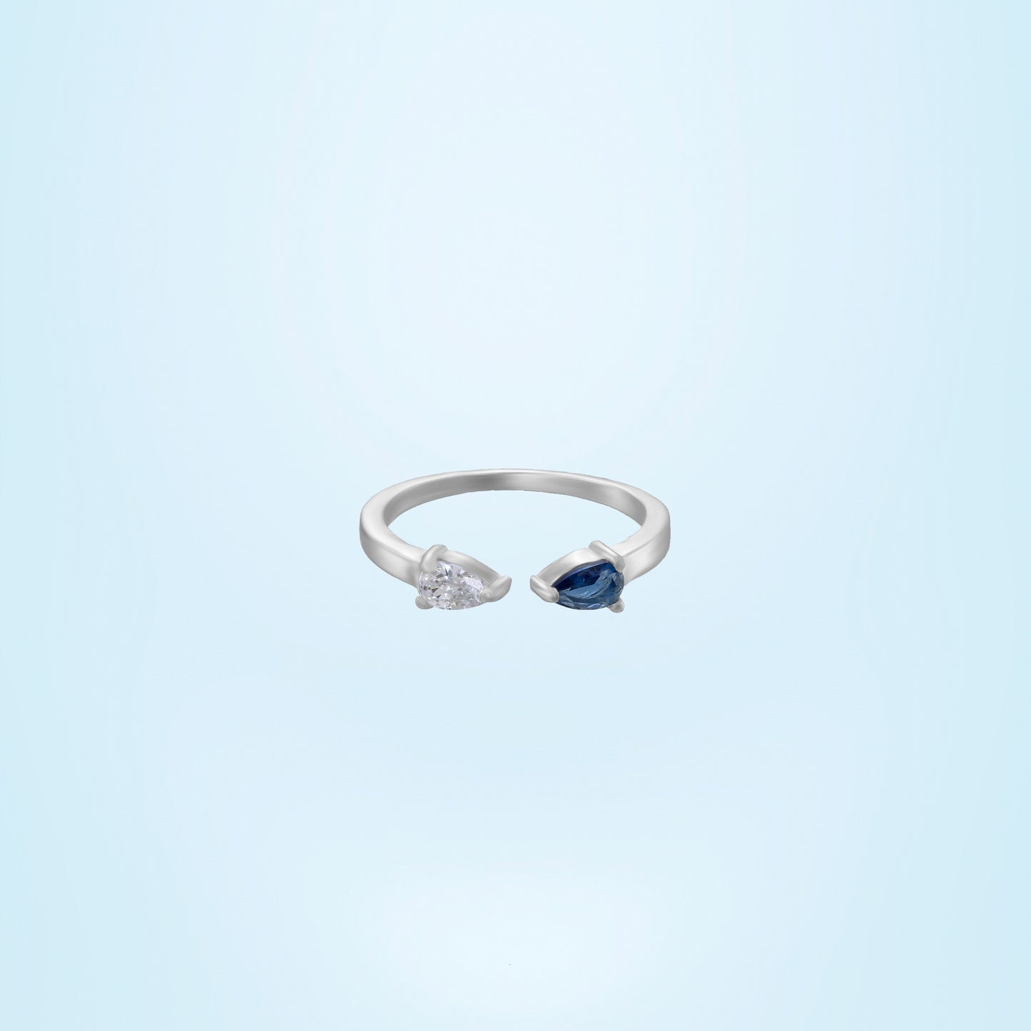 silver ring with a blue stone and a diamond