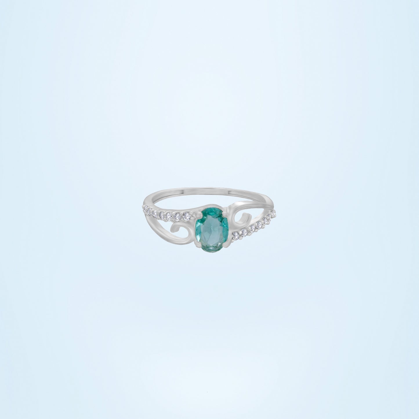 silver ring with a tourmal stone and green diamonds