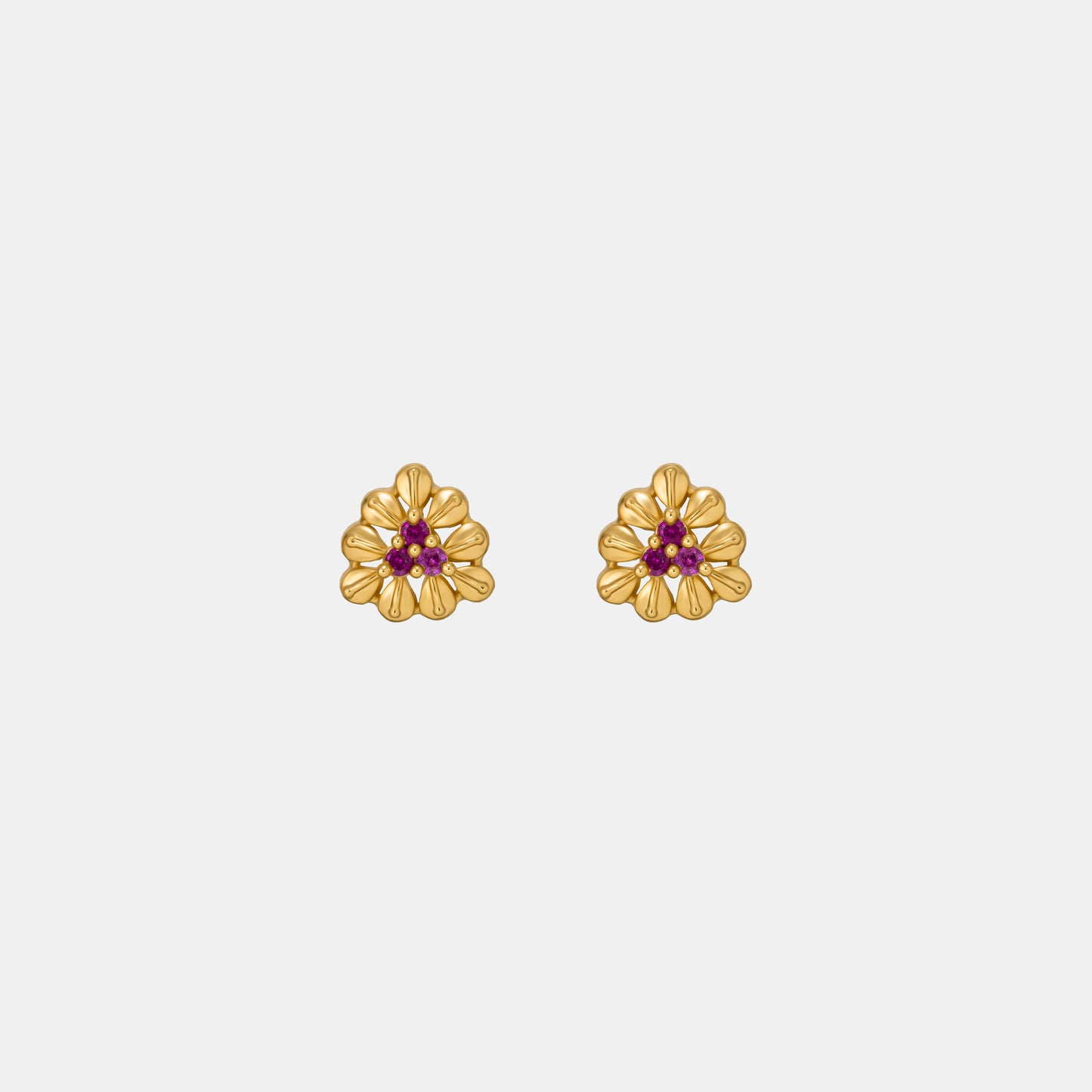 pair of golden and flower earrings