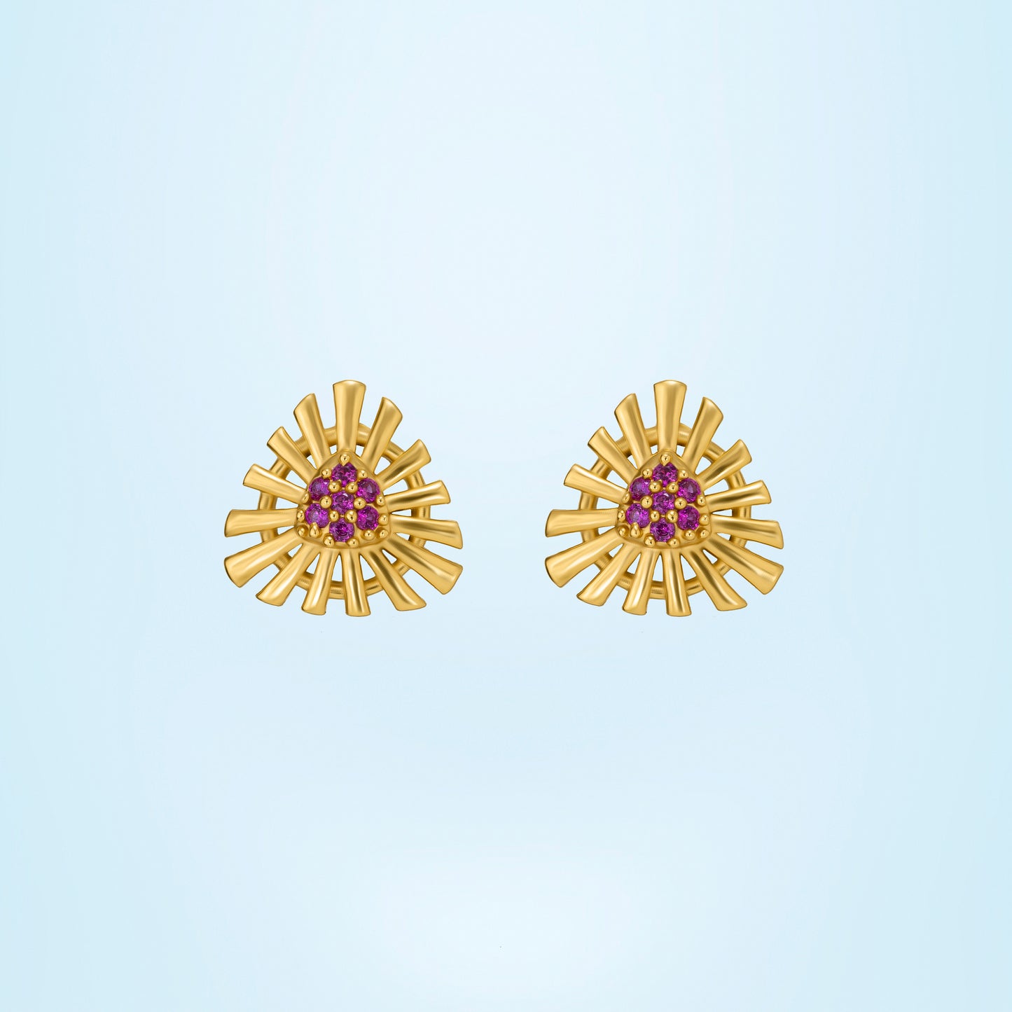 pair of golden earrings with stones