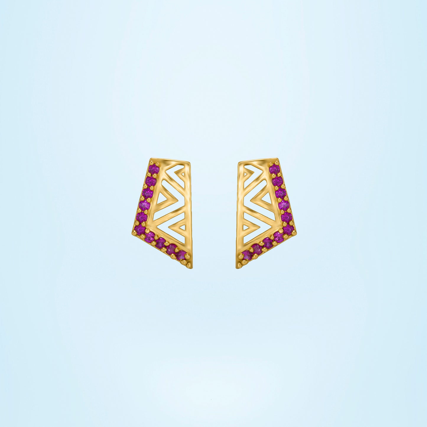 pair of golden earrings with stones