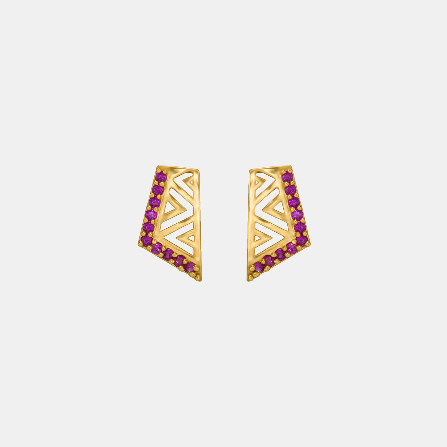 pair of golden earrings with stones