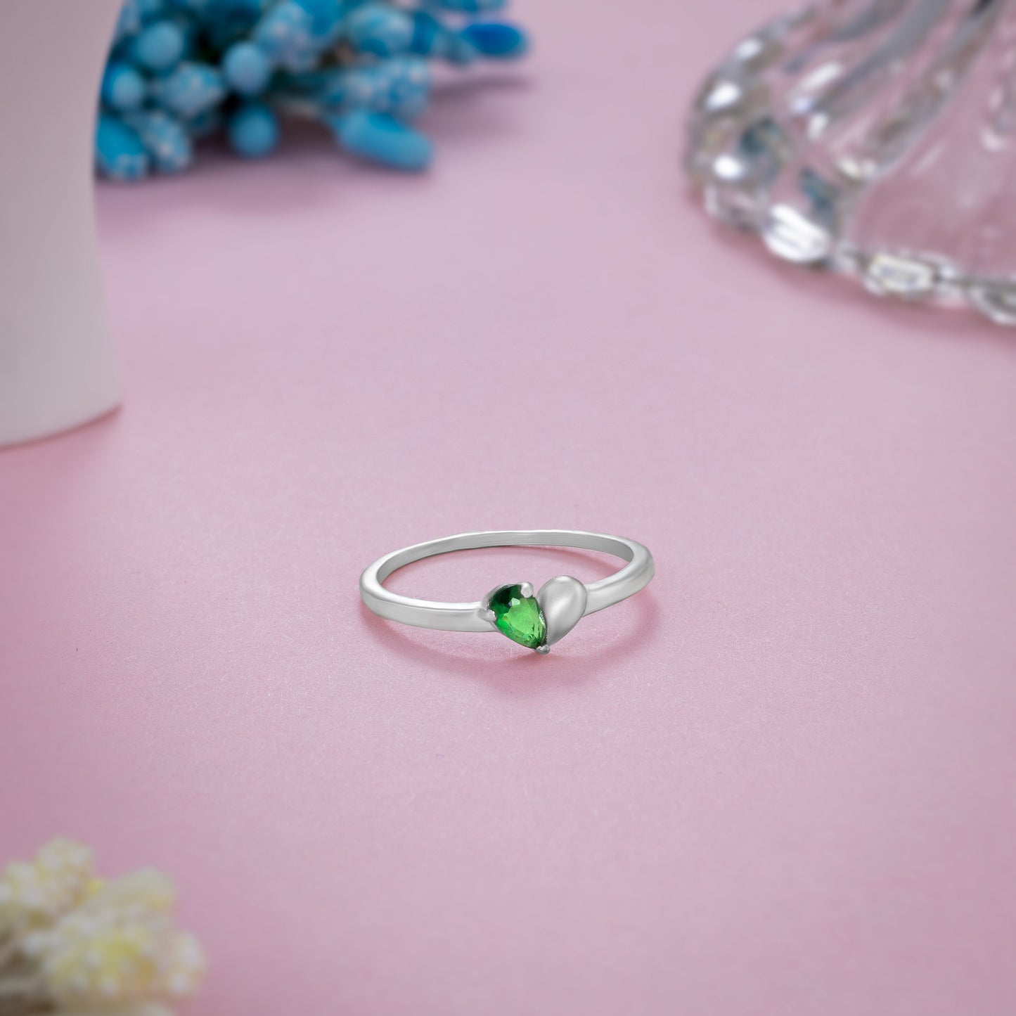 silver ring with a green stone