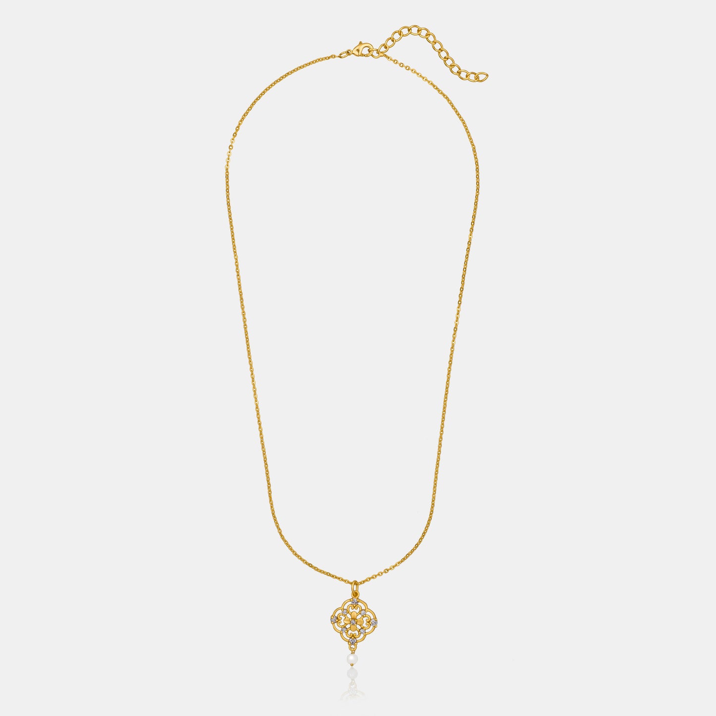 golden necklace with a flower design on it