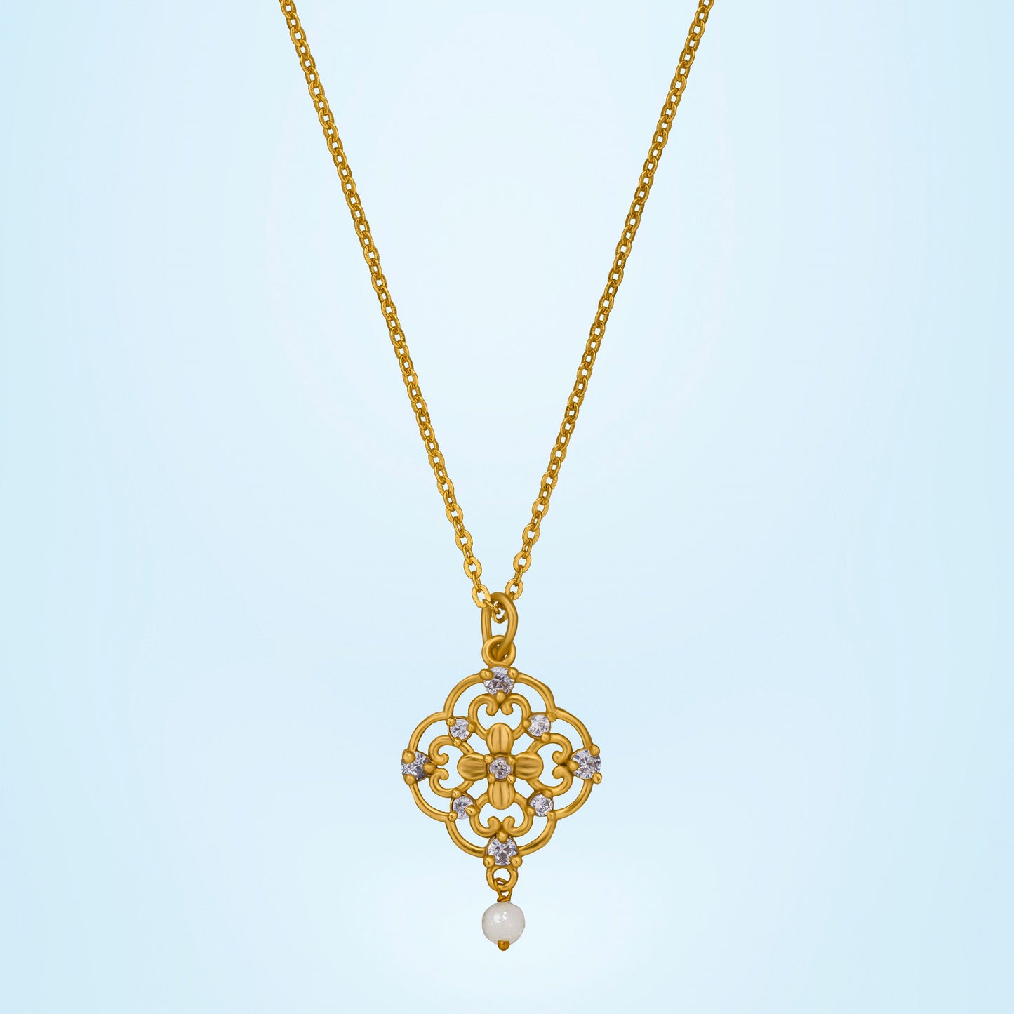 golden necklace with a flower design on it