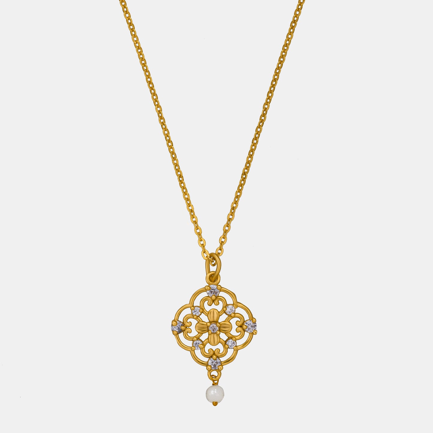 golden necklace with a flower design on it