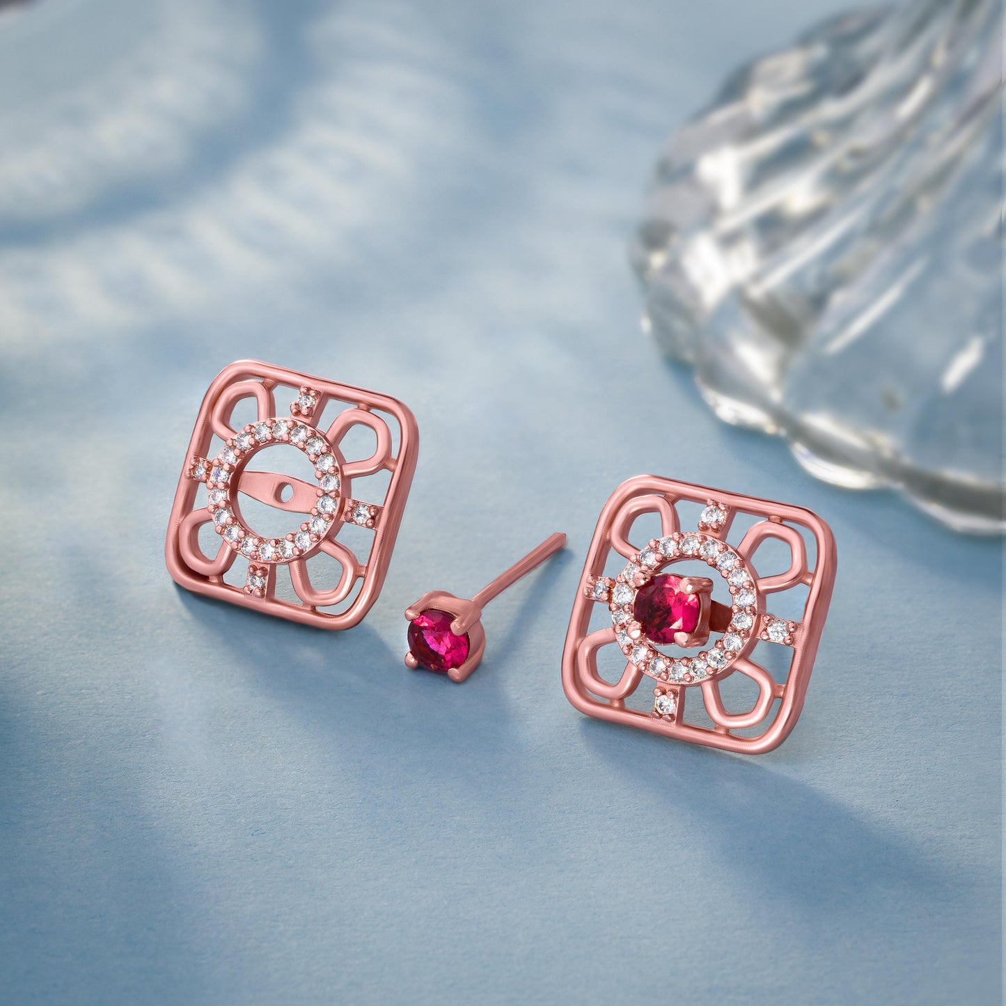 ruby earrings set in rose gold