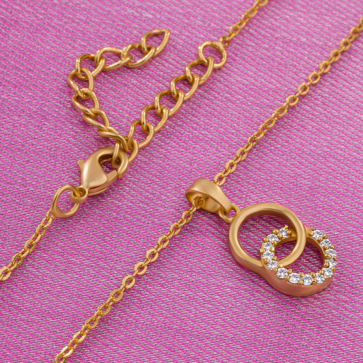 golden necklace with a diamond pendant