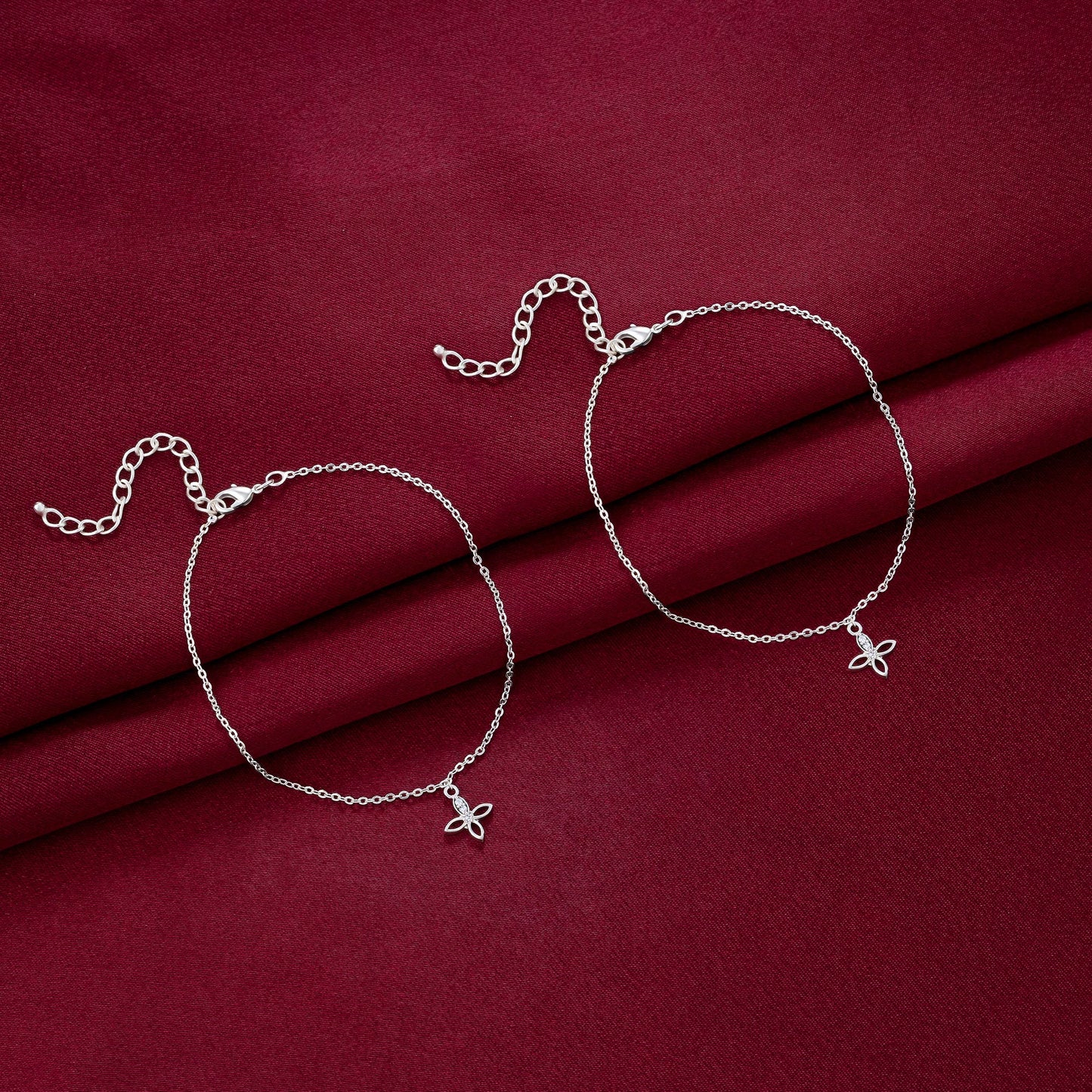 pair of silver anklets with diamonds