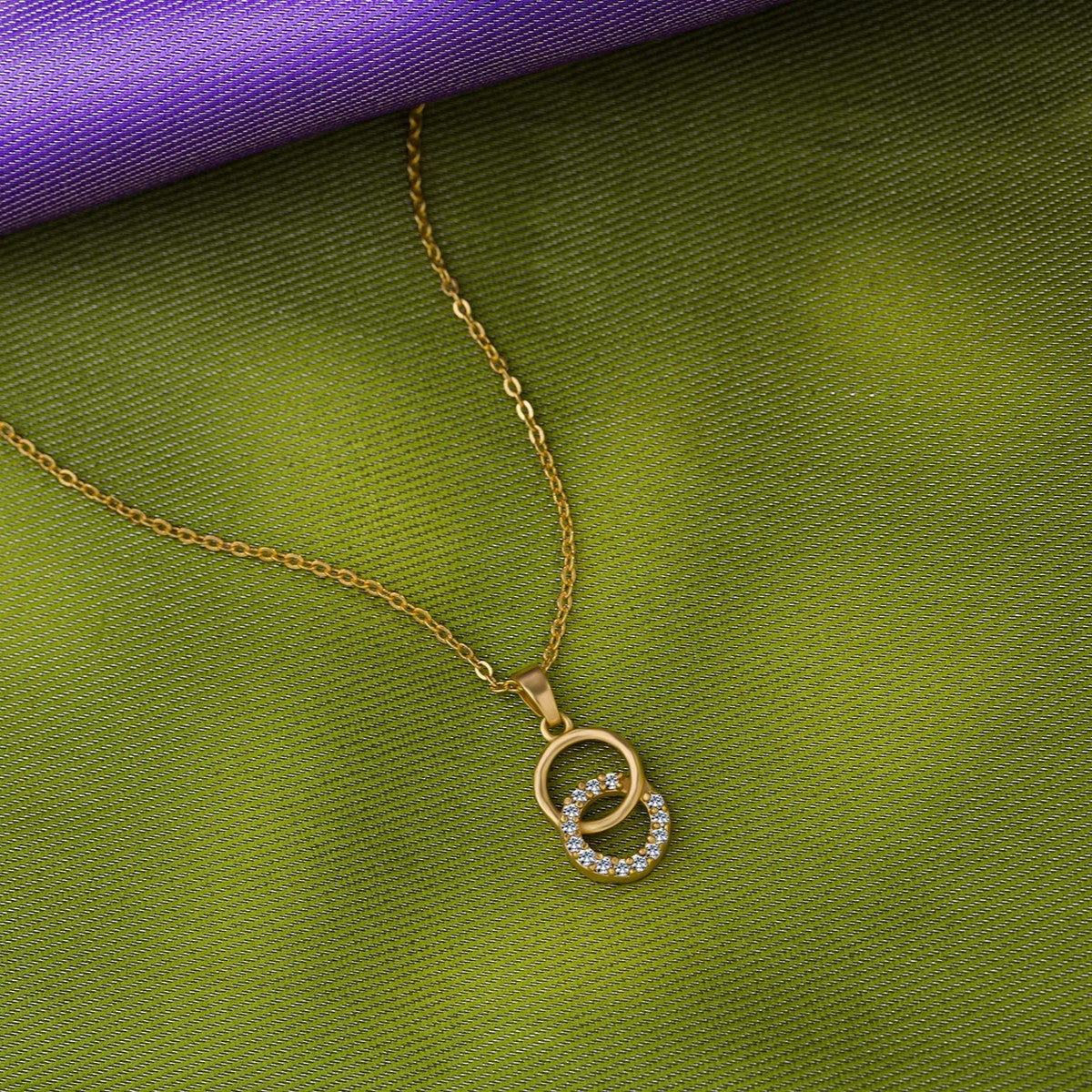 golden necklace with a diamond pendant