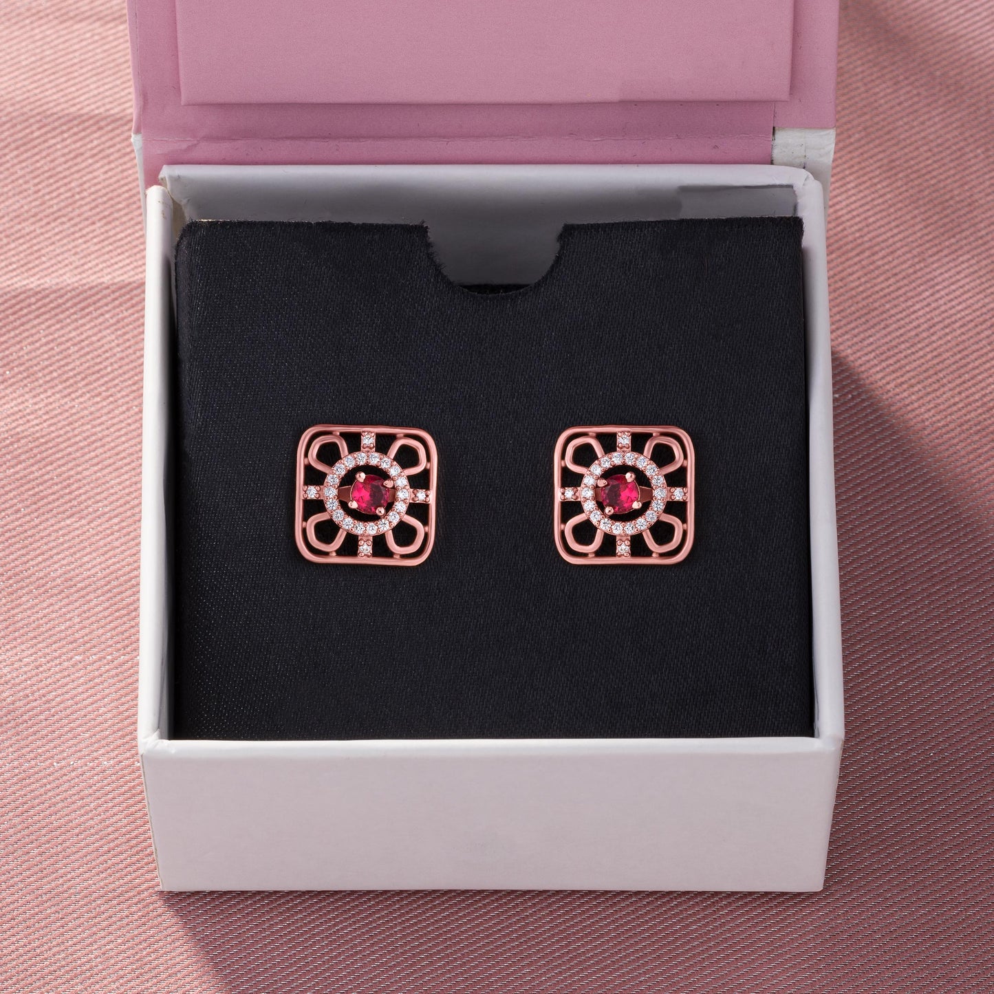 ruby earrings set in rose gold